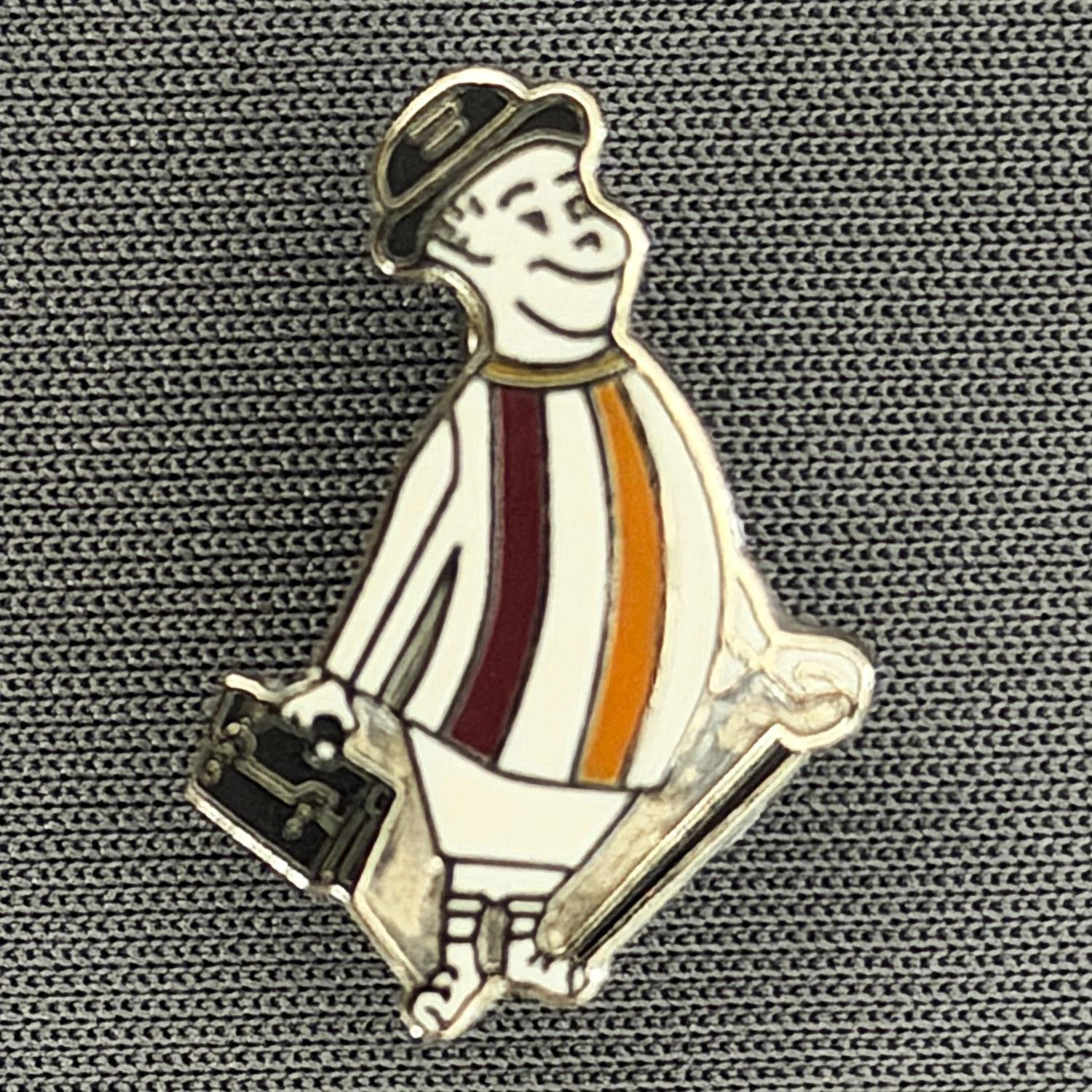 Reference Number: BCGEN121
Size: H 20.5 mm x W 15.5 mm
Pin Type: Brooch Pin
Plating: Silver
Value: £6
Manufacturer: Unknown
Comments: Small City Gent, Claret, Amber & White