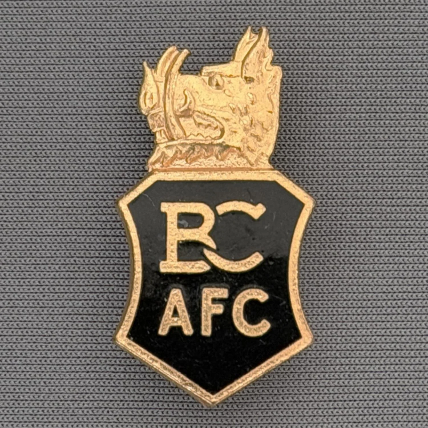 Reference Number: BCFIR001
Size: H 31.7 mm x W 16.6 mm
Pin Type: Brooch Pin
Plating: Gold
Value: £25
Manufacturer: FC Parry ?
Comments: Limited edition of 250 produced by Association of Football Badge Collectors to raise money for fire victims
