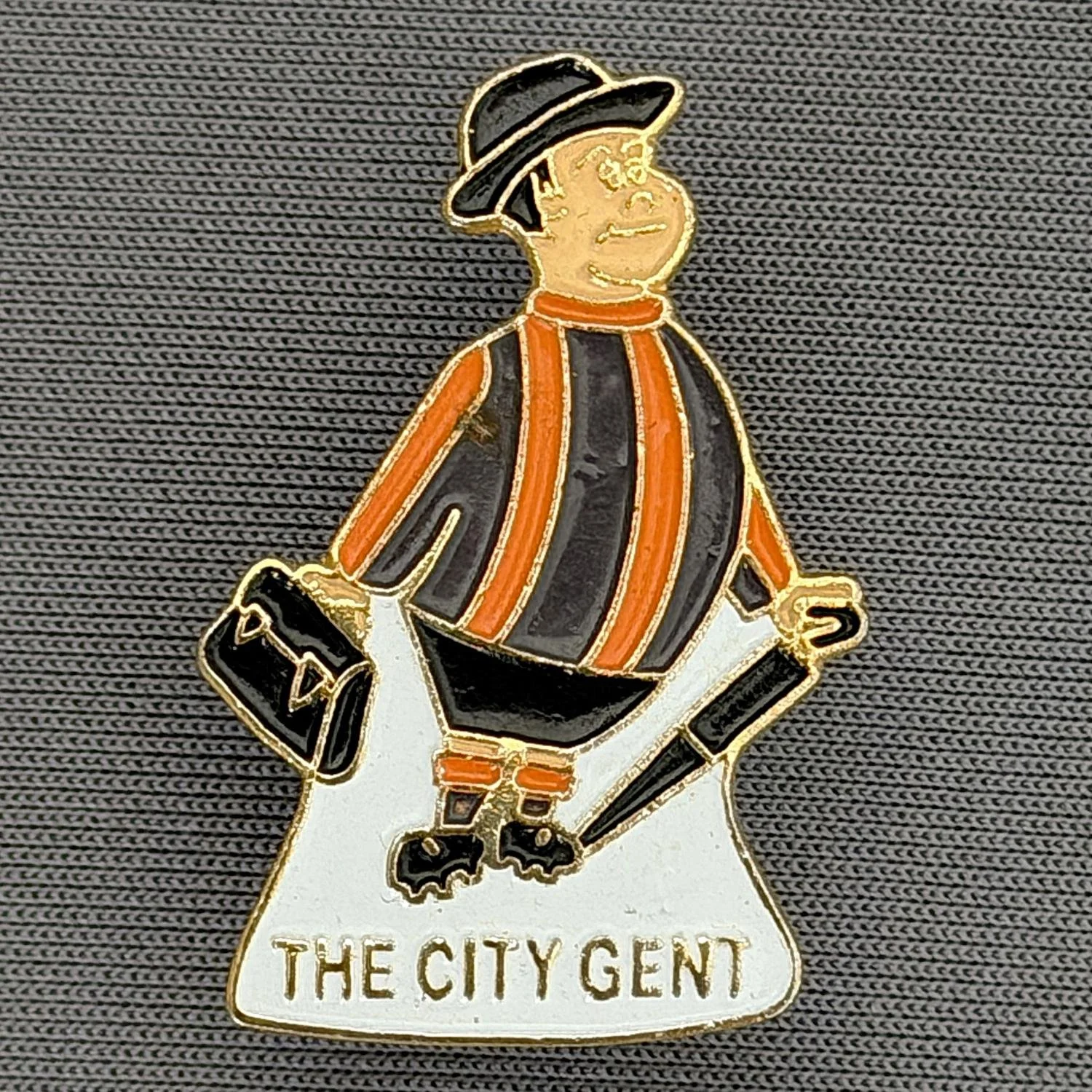 Reference Number: BCGEN010
Size: H 29.6 mm x W 19.9 mm
Pin Type: Metal Clutch
Plating: Gold
Value: £8
Manufacturer: Rocket Badges
Comments: Poor Quality City Gent