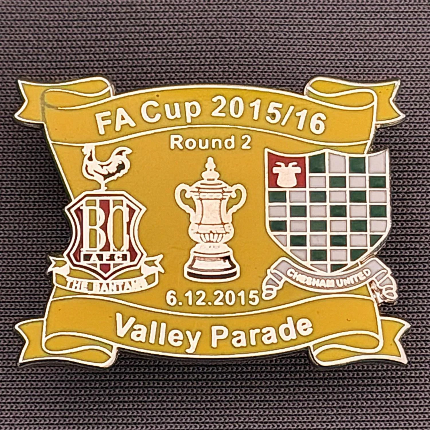 Reference Number: BCFAC143
Size: H 24.5 mm x W 32.5 mm
Pin Type: Metal Clutch
Plating: Silver
Value: £4
Manufacturer: Dan Lloyd
Comments: F.A. Cup Second Round 2015/16 v Chesham United, Amber Version