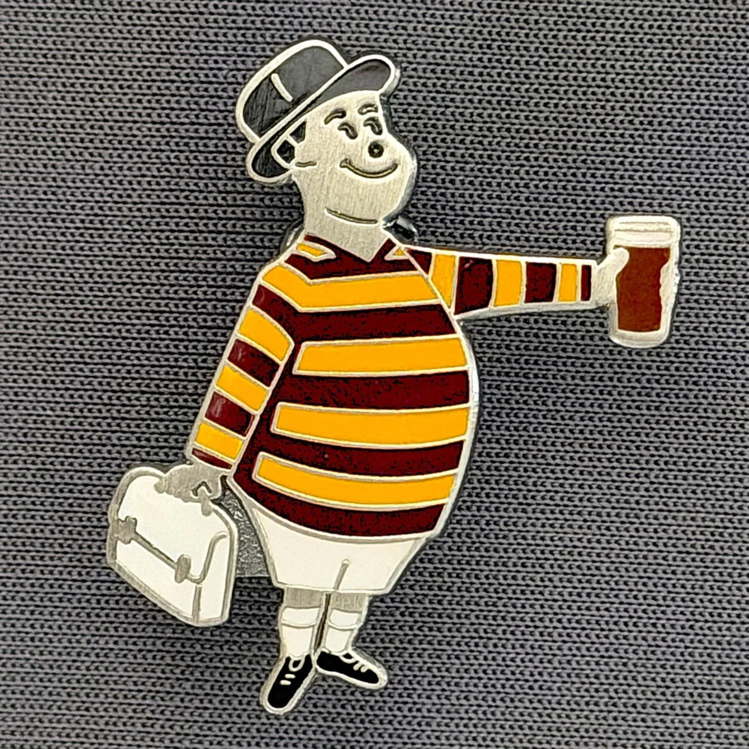 Reference Number: BCGEN088
Size: H 28.8 mm x W 20.9 mm
Pin Type: Brooch Pin
Plating: Antique Silver
Value: £20
Manufacturer: Bradford City Badges
Comments: City Gent Beer, White Briefcase. One Off Badge.