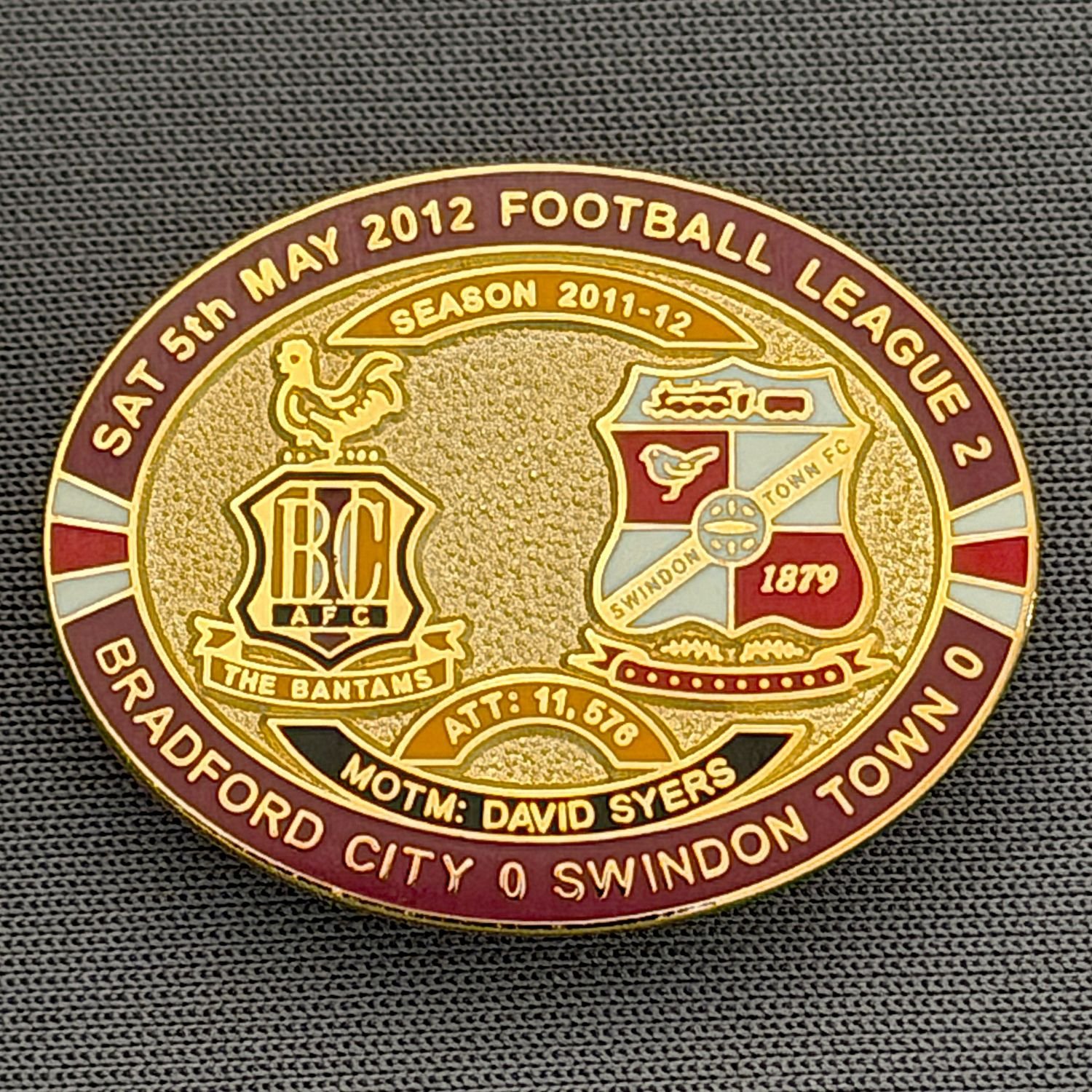 Reference Number: BCFIX092
Size: H 23.6 mm x W 28.7 mm
Pin Type: Brooch Pin
Plating: Gold
Value: £8
Manufacturer: Bradford City Badges
Comments: Bradford City v Swindon Town 2011/12 Limited Edition 80 Badges