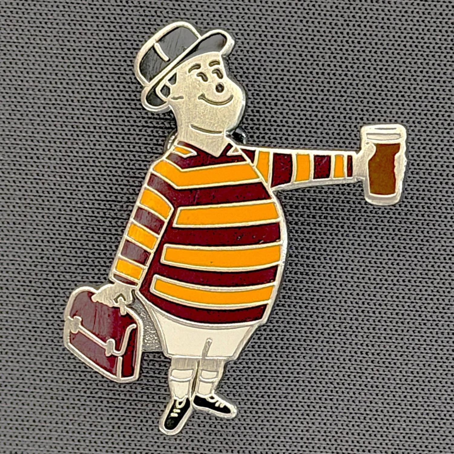 Reference Number: BCGEN066
Size: H 28.8 mm x W 20.9 mm
Pin Type: Brooch Pin
Plating: Antique Silver
Value: £20
Manufacturer: Bradford City Badges
Comments: City Gent Beer, Claret Briefcase. One Off Badge.