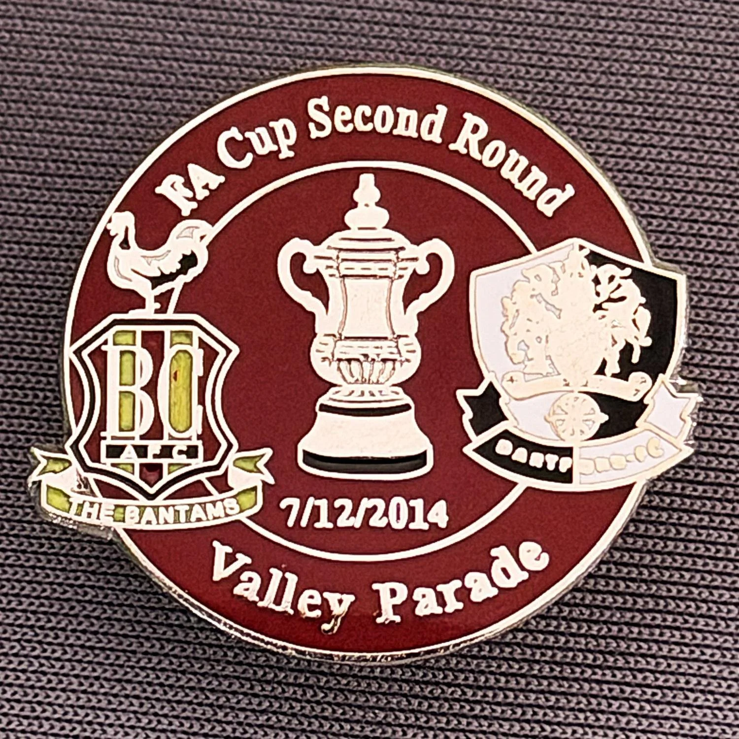 Reference Number: BCFAC066
Size: H 23.3 mm x W 25.6 mm
Pin Type: Metal Clutch
Plating: Silver
Value: £4
Manufacturer: Dan Lloyd
Comments: F.A. Cup Second Round 2014/15, v Dartford, Claret Version
