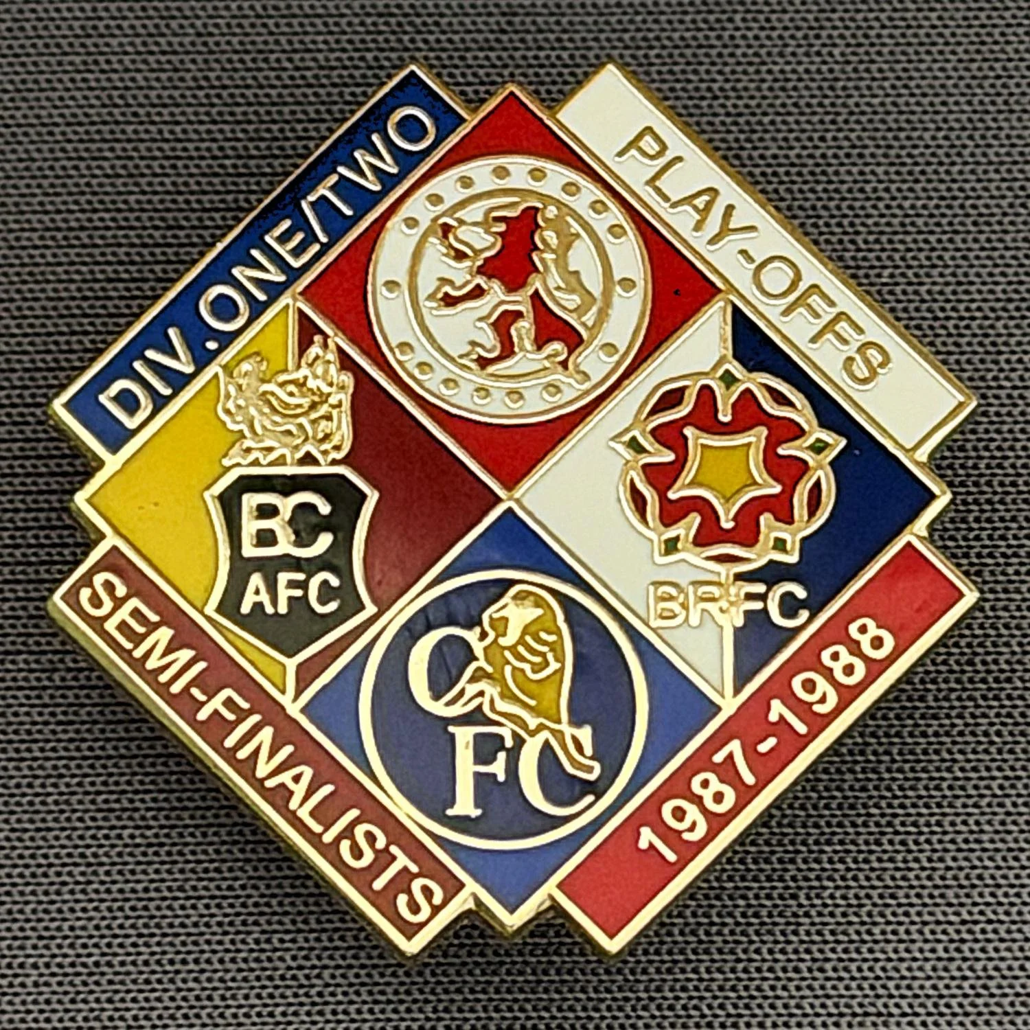 Reference Number: BCOFIX046
Size: H 29.8 mm x W 30 mm
Pin Type: Double Metal Clutch
Plating: Gold
Value: £8
Manufacturer: Unknown
Comments: 1987-1988 Play Off Semi Finalists Blue, White, Claret & Red Version, Limited Edition 50