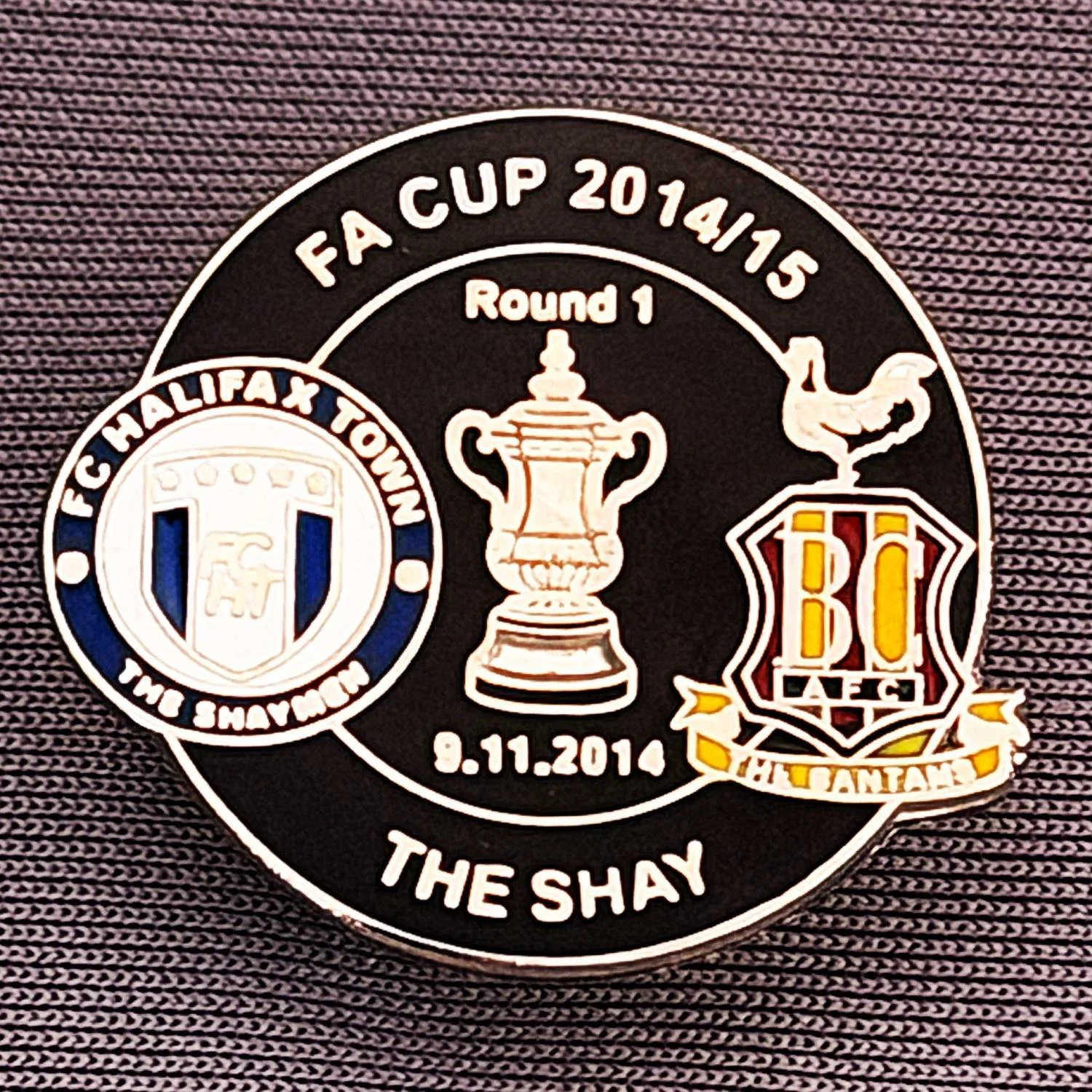 Reference Number: BCFAC056
Size: H 22. 7 mm x W 25.8 mm
Pin Type: Metal Clutch
Plating: Silver
Value: £4
Manufacturer: Dan Lloyd
Comments: F.A. Cup 2014/15 Away v Halifax Town, Black Version