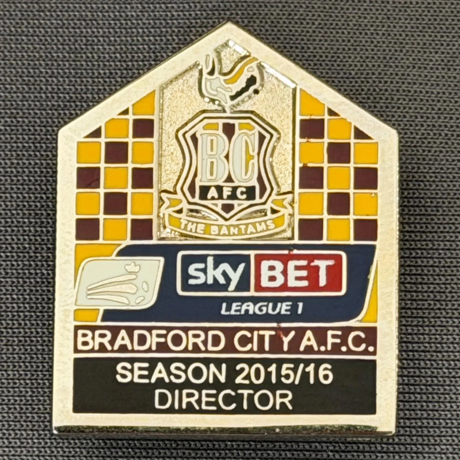Reference Number: BCDIR009
Size: H 29.2 mm x W 23.6 mm
Pin Type: Brooch Pin
Plating: Nickel
Value: £40
Manufacturer: Bradford City Badges
Comments: Worn by C.E.O. & Directors