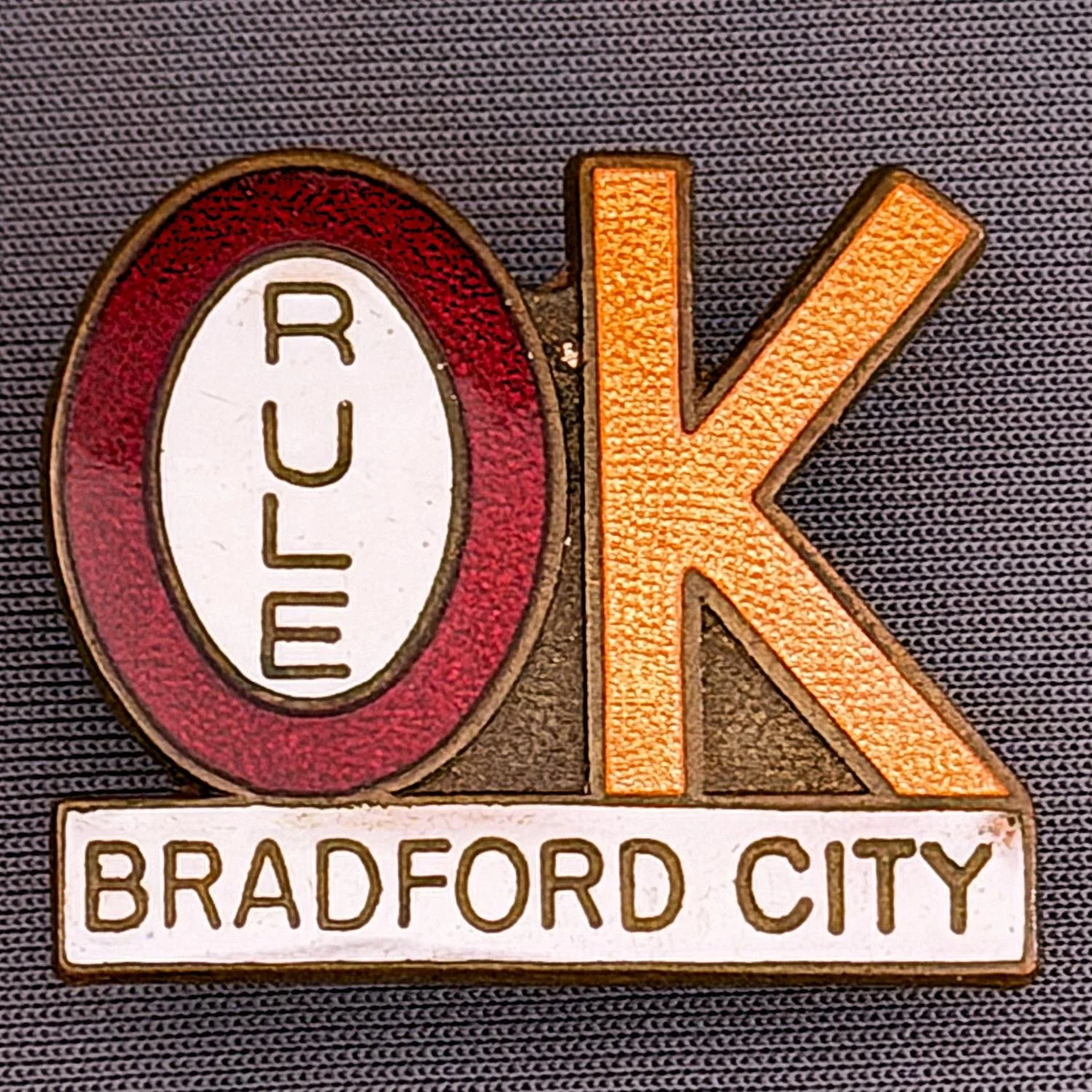 Reference Number: BCBCFC002
Size: H 26.6 mm x W 30.7 mm
Pin Type: Brooch Pin
Plating: Antique Brass
Value: £15
Manufacturer: Unknown
Comments: Bradford City Rule OK

