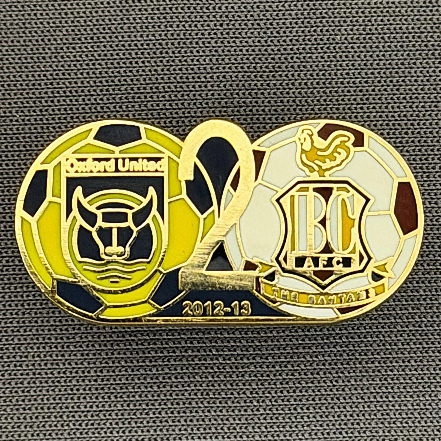 Reference Number: BCOFIX101
Size: H 13 mm x W 25.8 mm
Pin Type: Metal Clutch
Plating: Gold
Value: £5
Manufacturer: Unknown
Comments: Oxford United v Bradford City League Two 2012/13