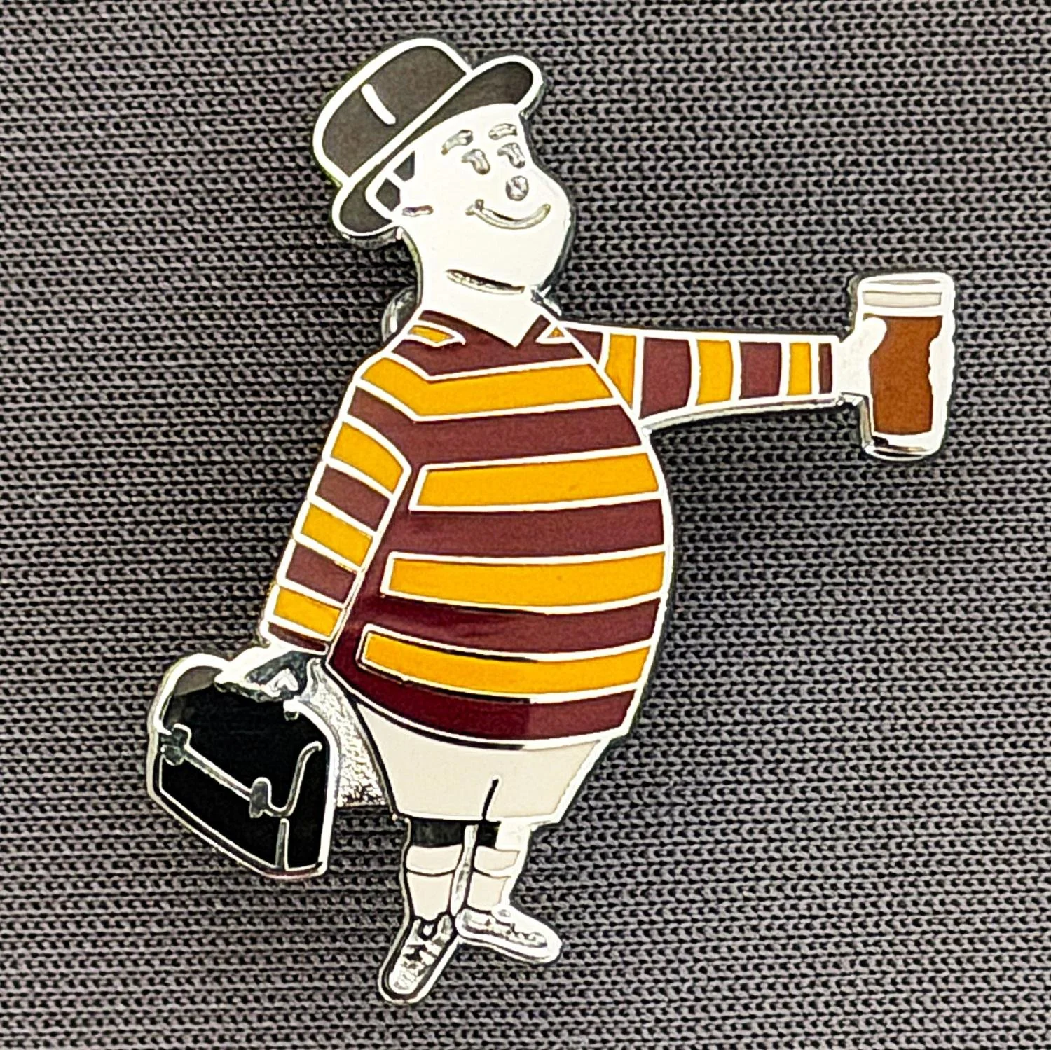 Reference Number: BCGEN077
Size: H 28.8 mm x W 20.9 mm
Pin Type: Brooch Pin
Plating: Silver
Value: £20
Manufacturer: Bradford City Badges
Comments: City Gent Beer, Black Briefcase. One Off Badge.