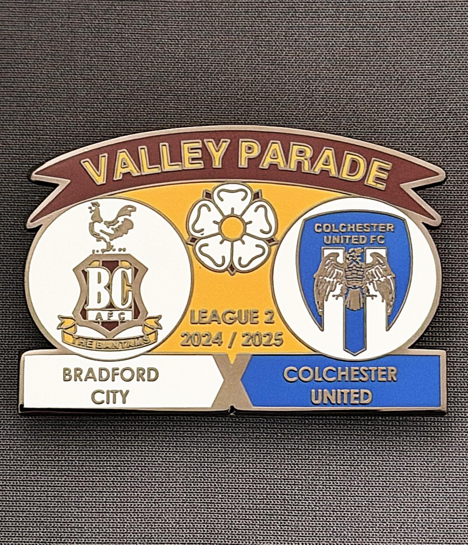 Reference Number: BCFIX435
Size: H 34.3 mm x W 50 mm
Pin Type: Brooch Pin
Plating: Black Nickel
Value: £5
Manufacturer: Unknown
Comments: Bradford City v Colchester United 2024/25.