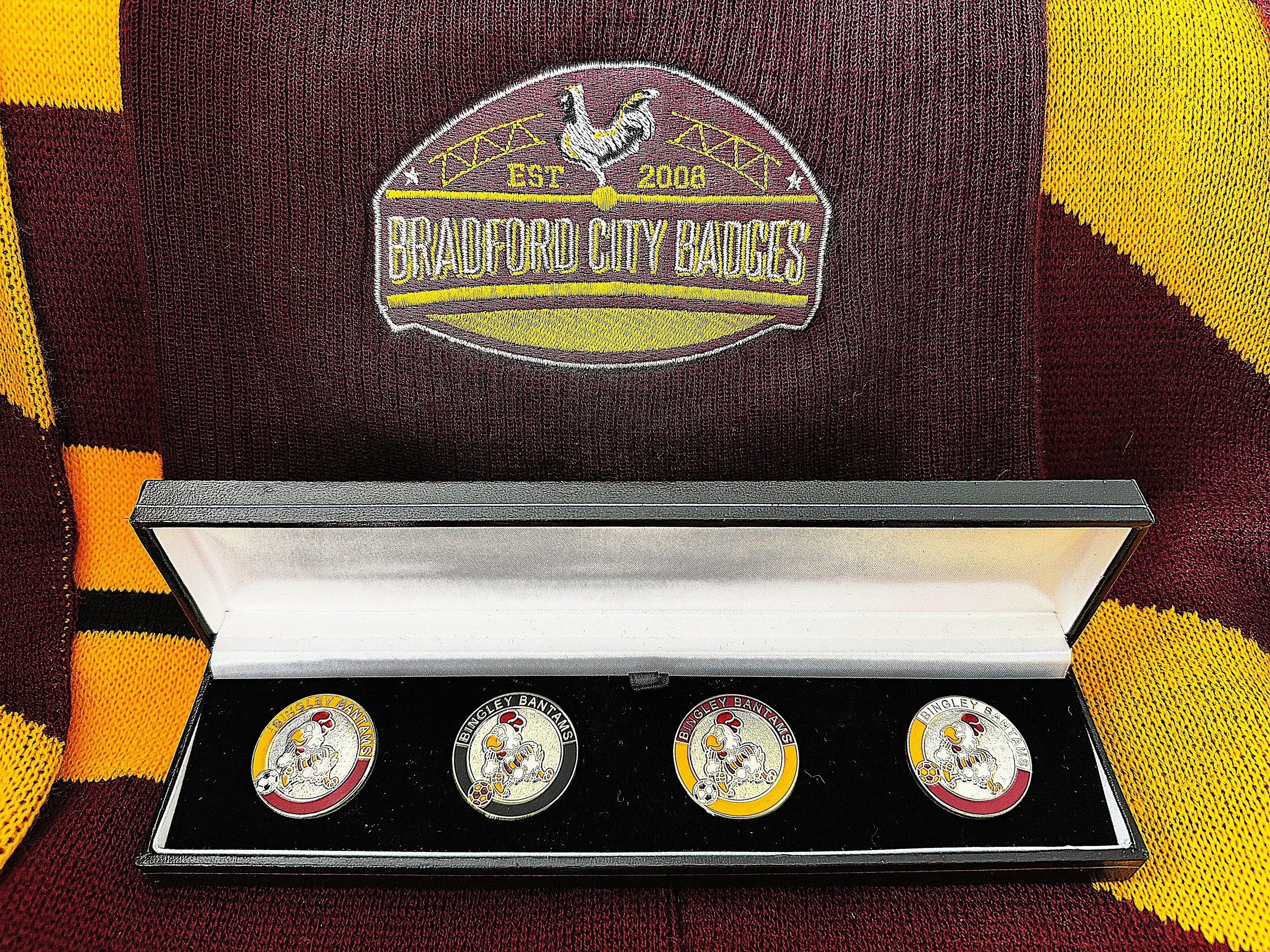 Embroidery patch on maroon fabric shows a rooster, a bridge, stars, and the text 'EST 2008' and 'Bradford City Badges' in yellow.
