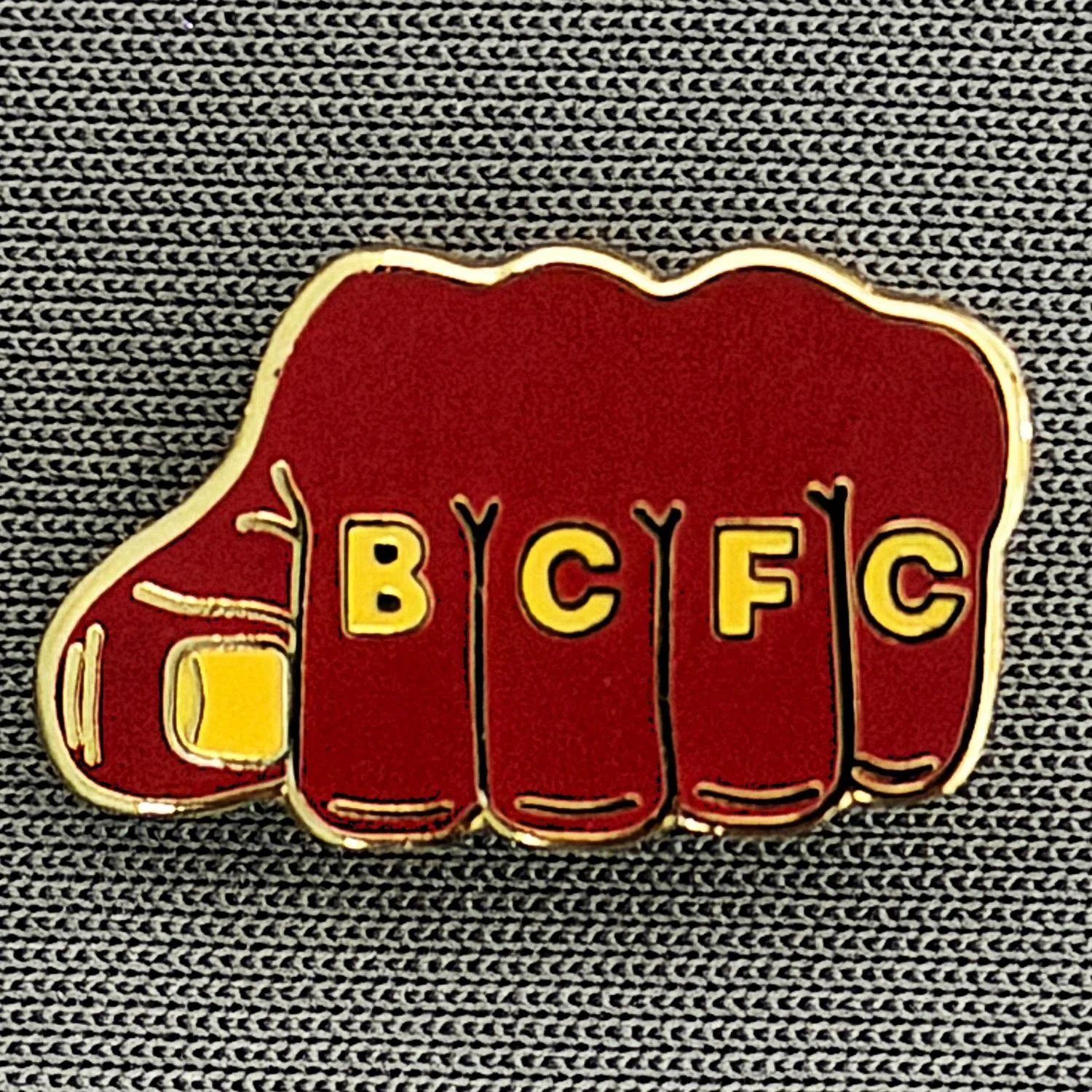 Reference Number: BCBCFC045
Size: H 11.6 mm x W 19.8 mm
Pin Type: Brooch Pin
Plating: Gold
Value: £6
Manufacturer: Unknown
Comments: BCFC Claret & Amber Fist