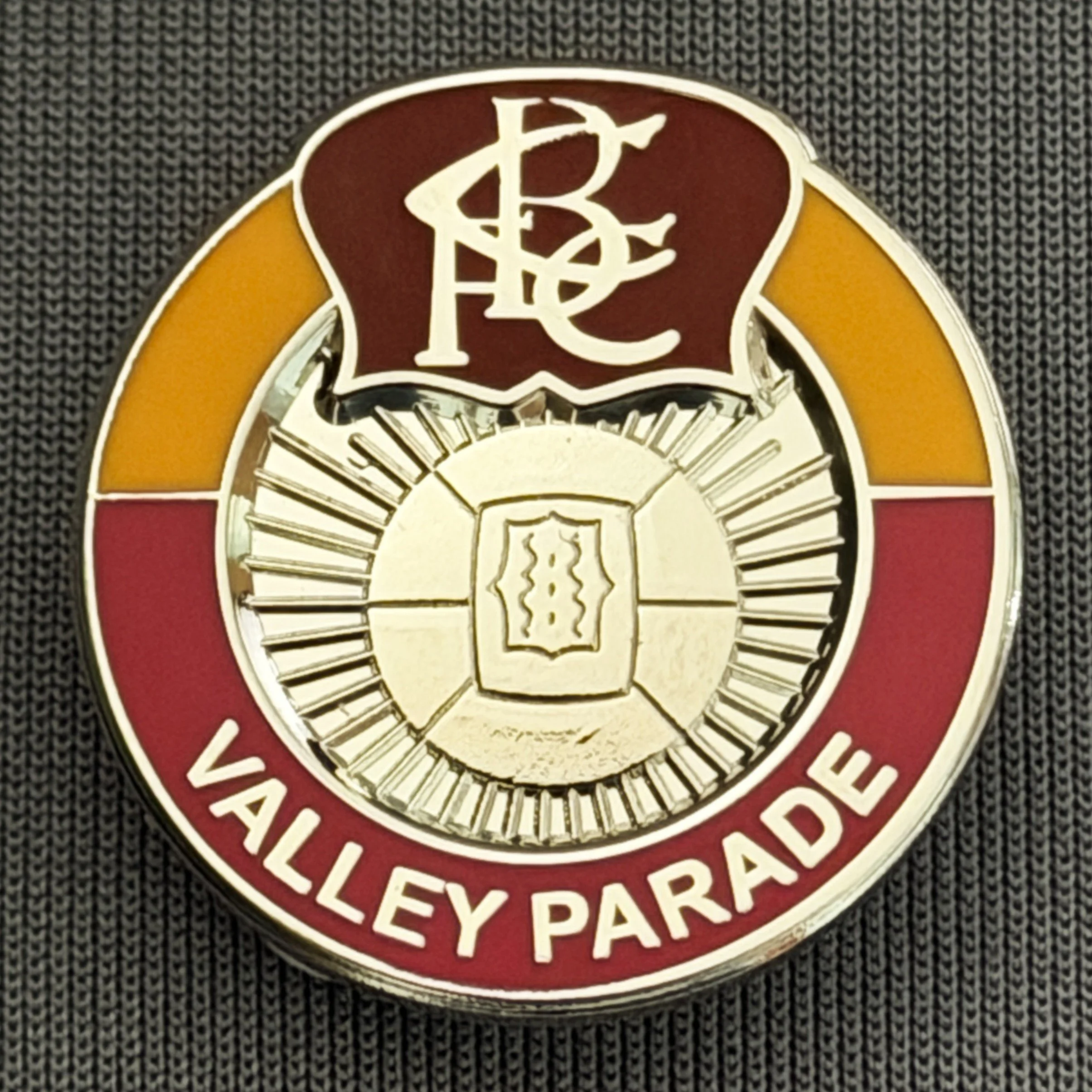 Reference Number: BCVP016
Size: H 24.2 mm x W 23.6 mm
Pin Type: Brooch Pin
Plating: Silver
Value: £4
Manufacturer: Unknown
Comments: Claret, Amber & Red, Bradford Park Avenue Style, Valley Parade