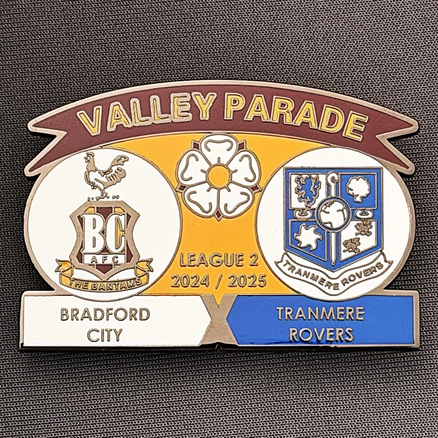 Reference Number: BCFIX434
Size: H 34.3 mm x W 50 mm
Pin Type: Brooch Pin
Plating: Black Nickel
Value: £5
Manufacturer: Unknown
Comments: Bradford City v Tranmere Rovers 2024/25.