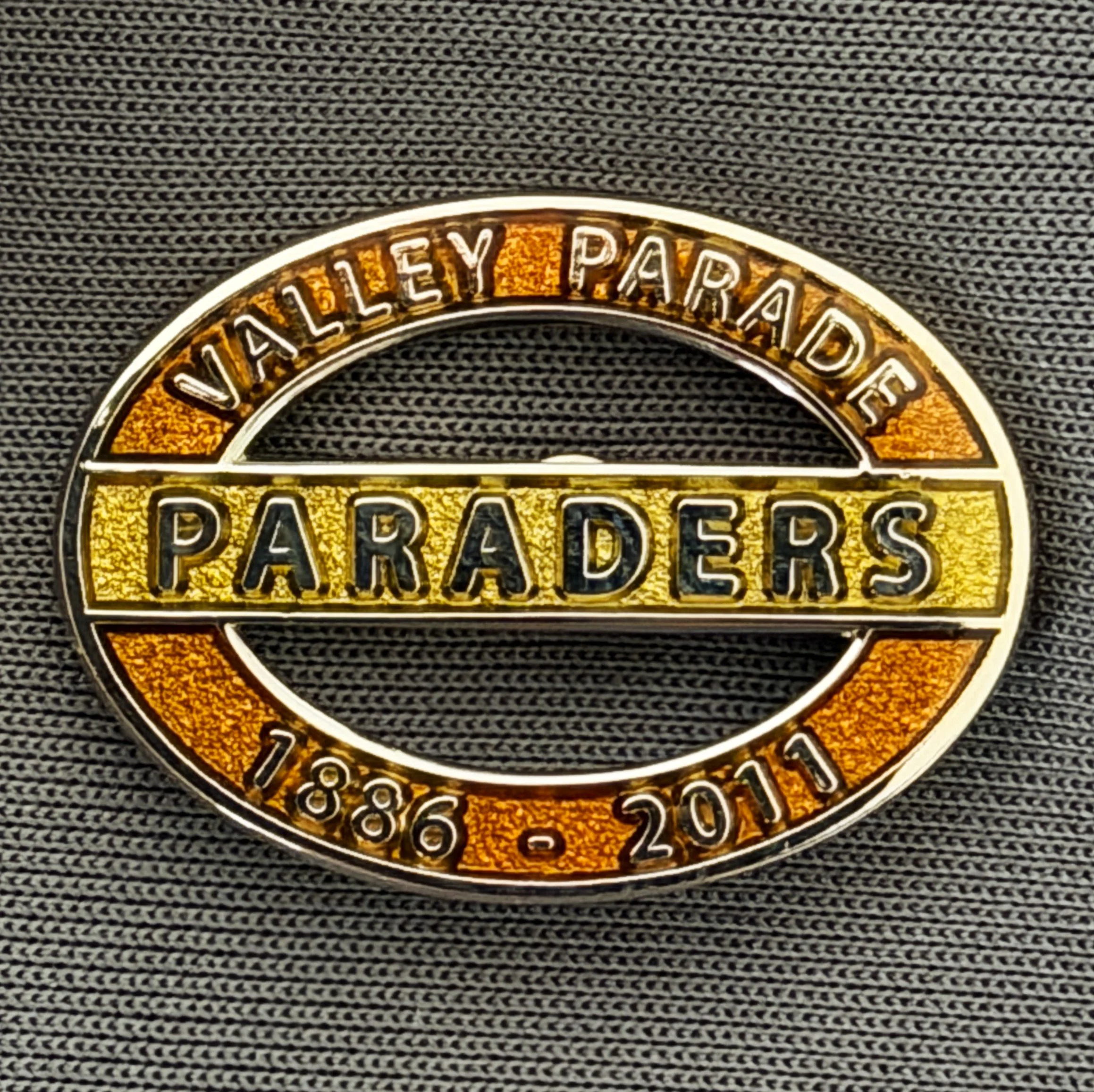Reference Number: BCVP009
Size: H 18.2 mm x W 25 mm
Pin Type: Brooch Pin
Plating: Silver
Value: £8
Manufacturer: Paraders
Comments: Valley Parade, Paraders, 1886-2011, Amber & Yellow