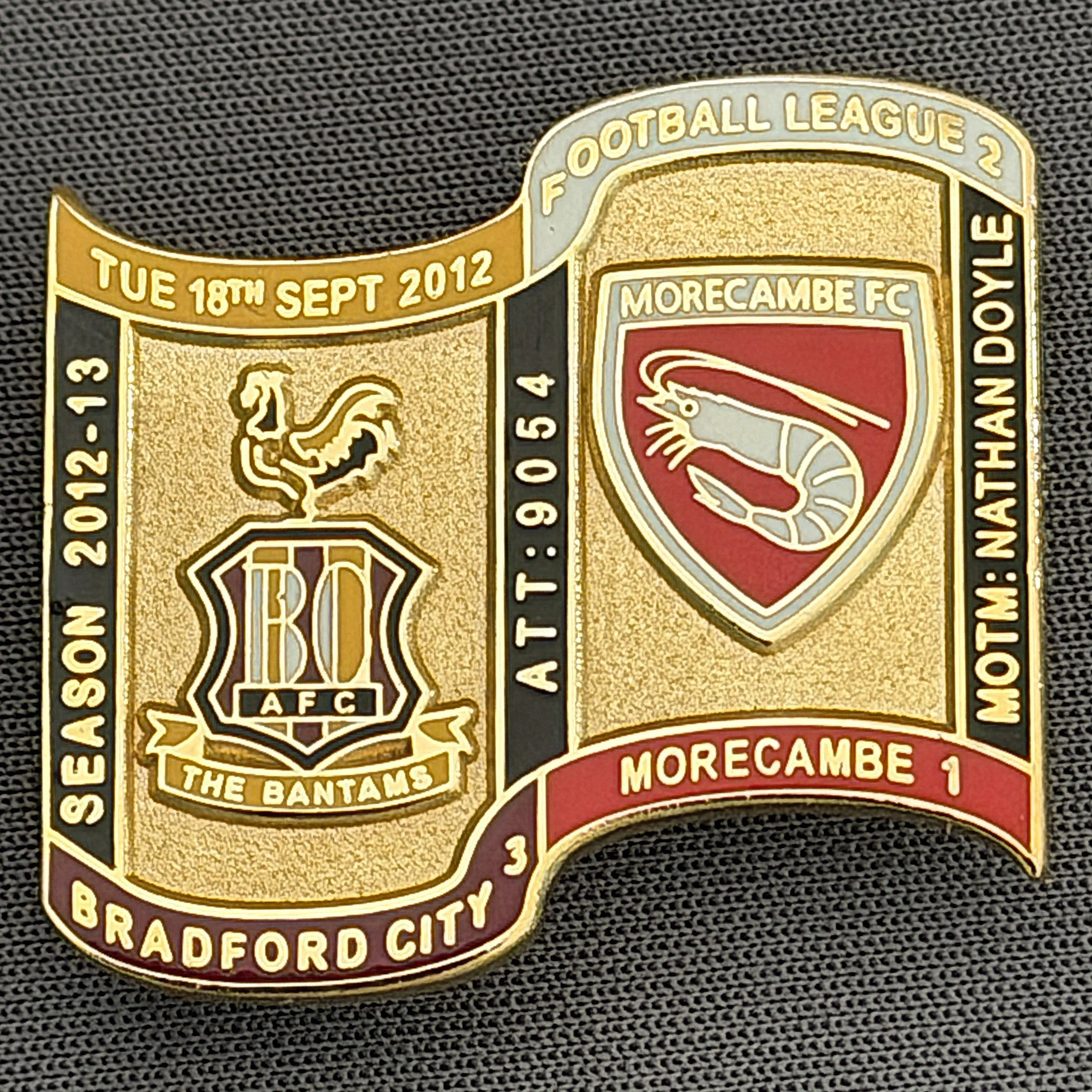 Reference Number: BCFIX119
Size: H 26.9 mm x W 29.2 mm
Pin Type: Brooch Pin
Plating: Gold
Value: £8
Manufacturer: Bradford City Badges
Comments: Bradford City v Morecambe 2012/13 Limited Edition 65 Badges