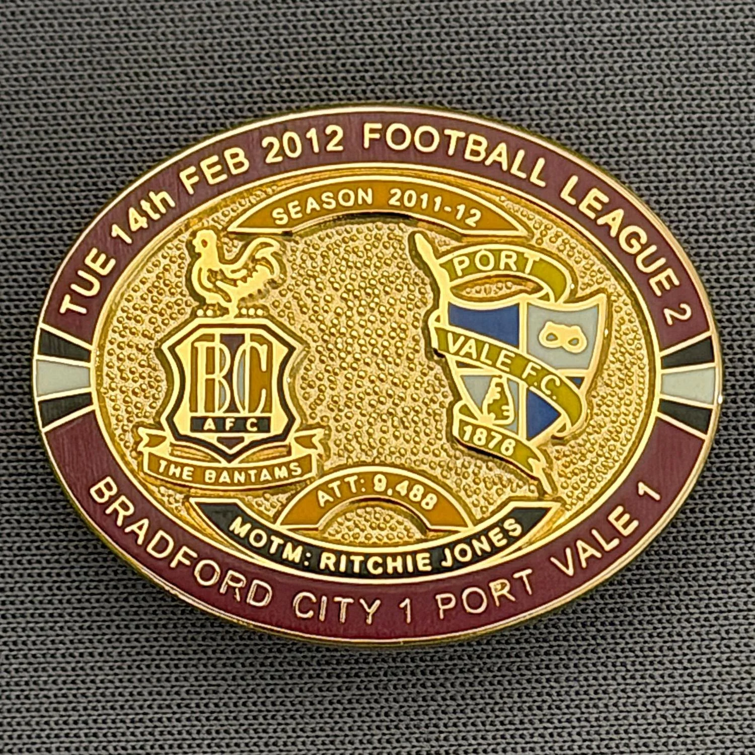 Reference Number: BCFIX084
Size: H 23.6 mm x W 28.7 mm
Pin Type: Brooch Pin
Plating: Gold
Value: £8
Manufacturer: Bradford City Badges
Comments: Bradford City v Port Vale  2011/12 Limited Edition 80 Badges