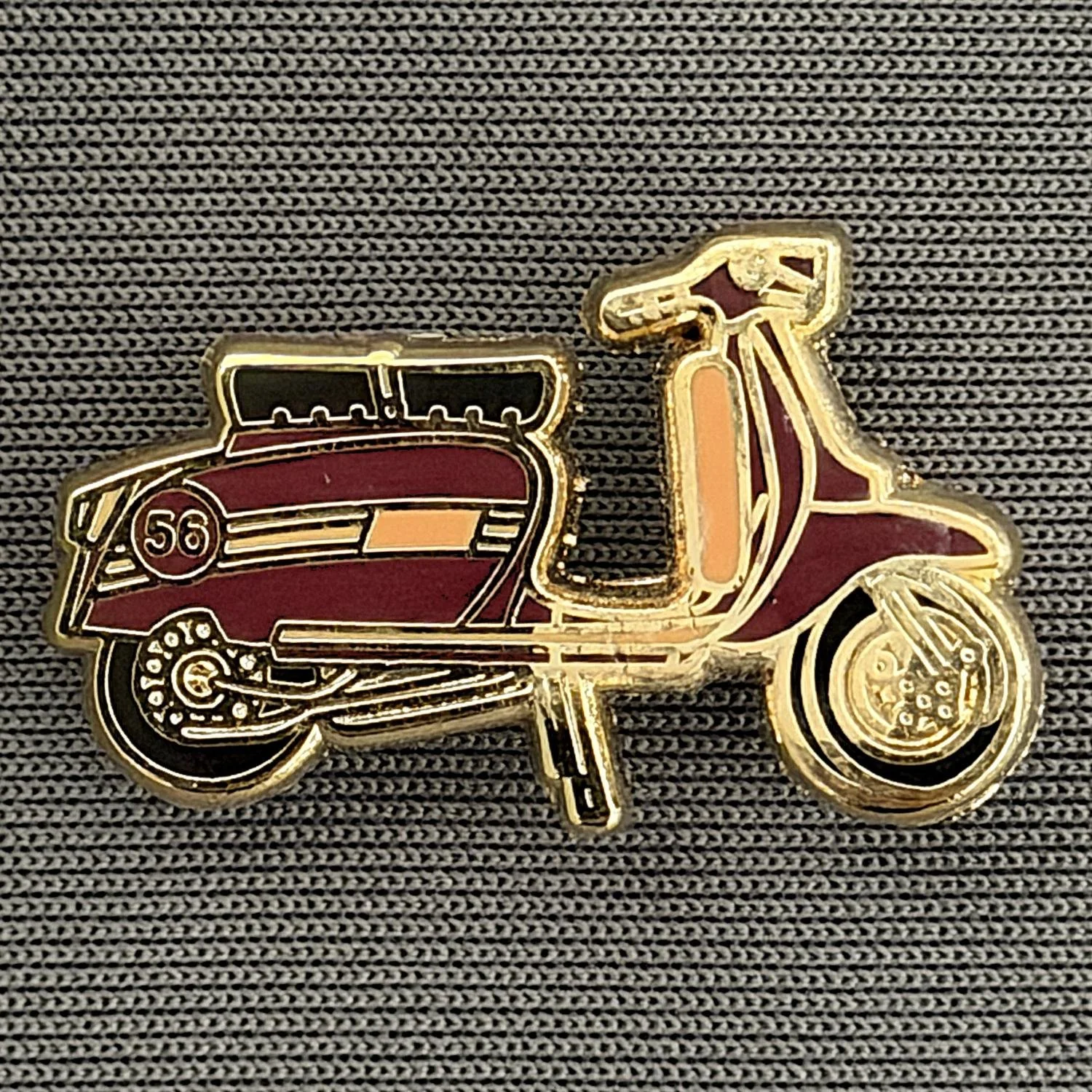 Reference Number: BCUN042
Size: H 15.4 mm x W 25.2 mm
Pin Type: Brooch Pin
Plating: Gold
Value: £6
Manufacturer: Unknown
Comments: Claret & Amber Scooter 56, Small Version