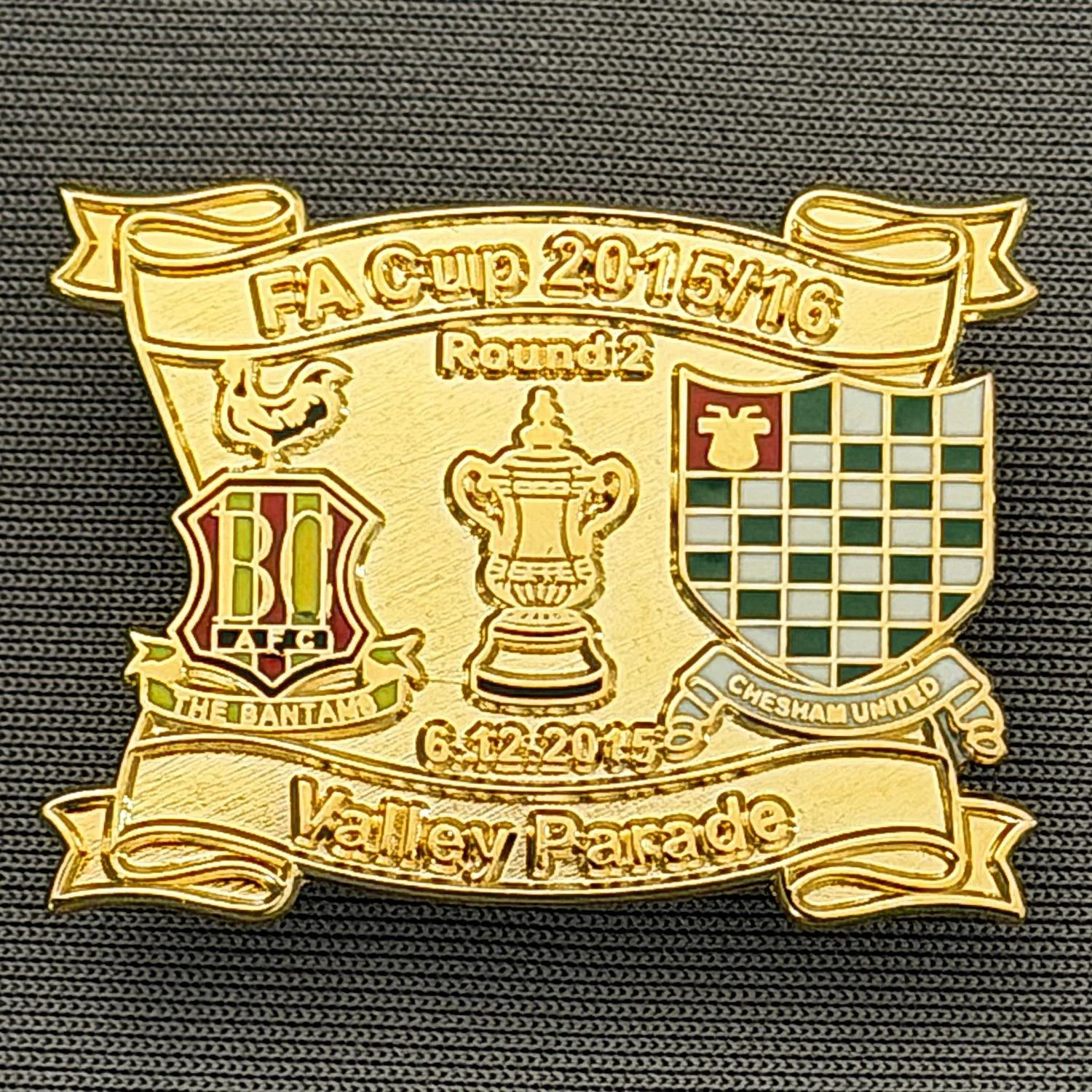 Reference Number: BCFAC150
Size: H 24.5 mm x W 32.5 mm
Pin Type: Metal Clutch
Plating: Gold
Value: £4
Manufacturer: Dan Lloyd
Comments: F.A. Cup Second Round 2015/16 v Chesham United, Gold Version