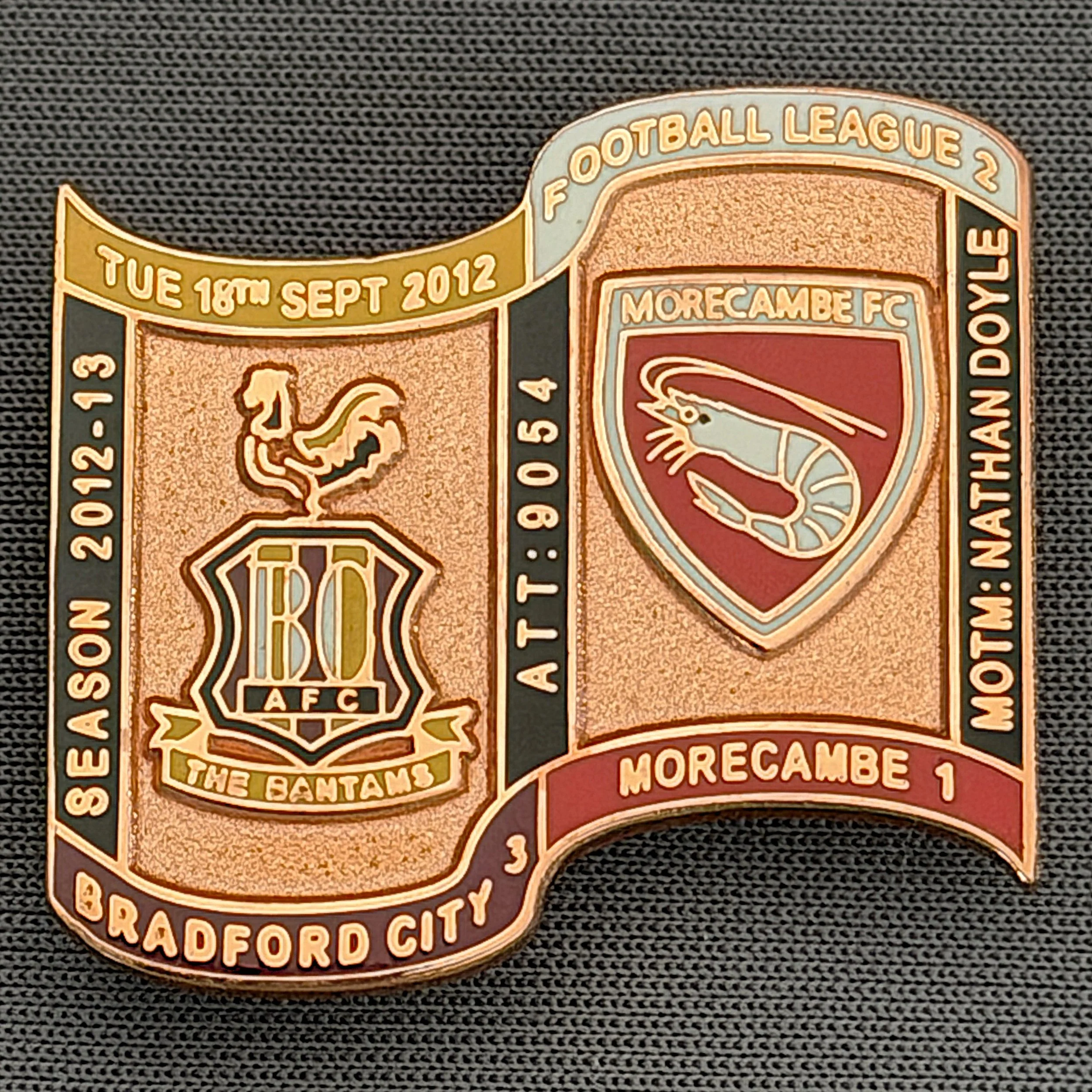Reference Number: BCFIX165
Size: H 26.9 mm x W 29.2 mm
Pin Type: Brooch Pin
Plating: Copper
Value: £12
Manufacturer: Bradford City Badges
Comments: Bradford City v Morecambe 2012/13 Limited Edition 1 Badge (Copper Version)