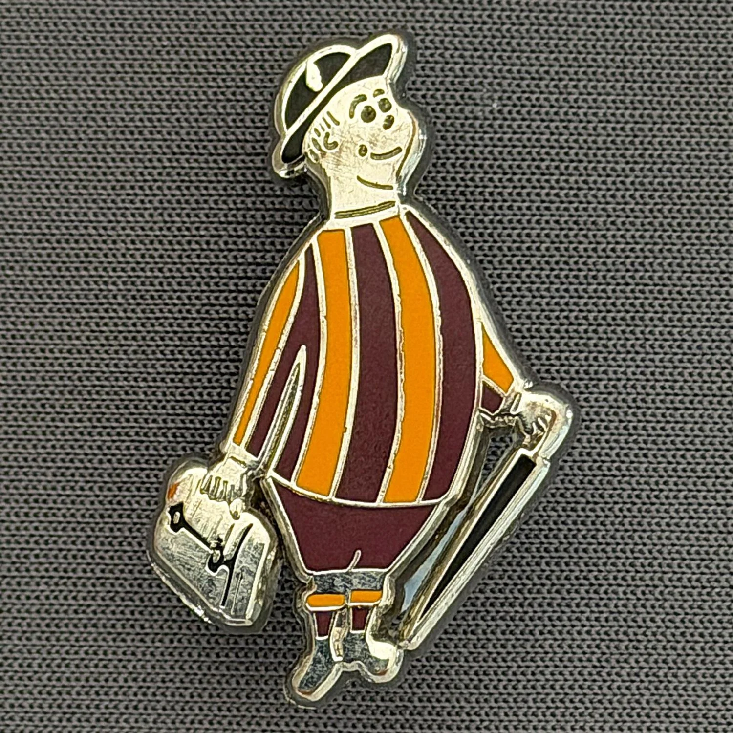 Reference Number: BCGEN052
Size: H 29 mm x W 18.4 mm
Pin Type: Plastic Clutch
Plating: Silver
Value: £15
Manufacturer: Unknown
Comments: City Gent Claret Shorts. Similar Badge Sold on eBay June 2026 For £26.75