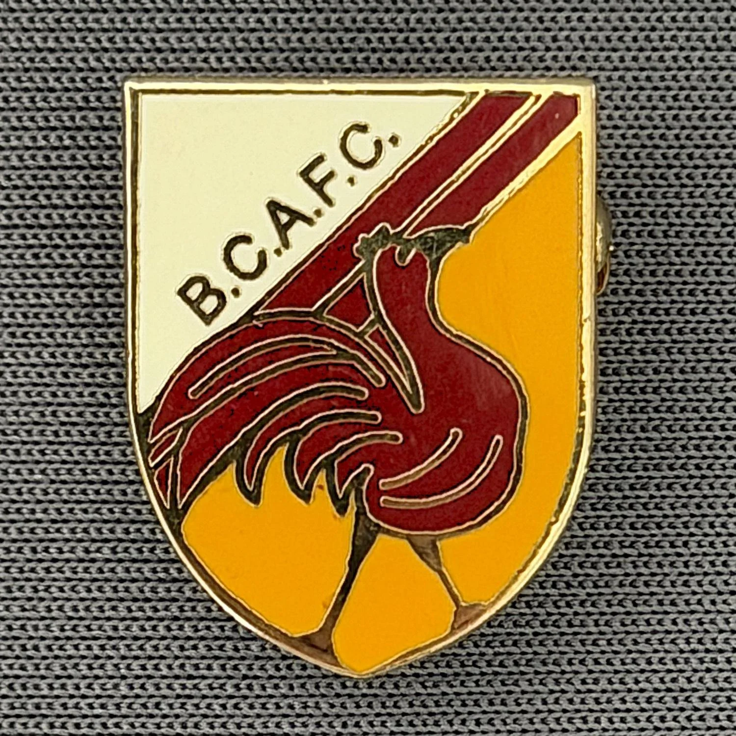 Reference Number: BCBAN043
Size: H 18 mm x W 14.1 mm
Pin Type: Brooch Pin
Plating: Gold
Value: £6
Manufacturer: Unknown
Comments: Claret, Amber & White Bantam Shield