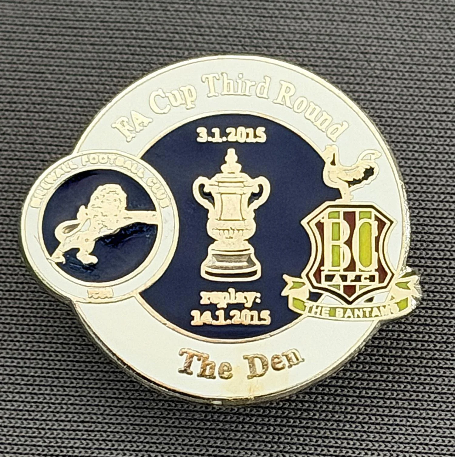 Reference Number: BCFAC083
Size: H 22.7 mm x W 26 mm
Pin Type: Metal Clutch
Plating: Silver
Value: £4
Manufacturer: Dan Lloyd
Comments: F.A. Cup Third Round 2014/15, Away v Millwall, White & Blue Version