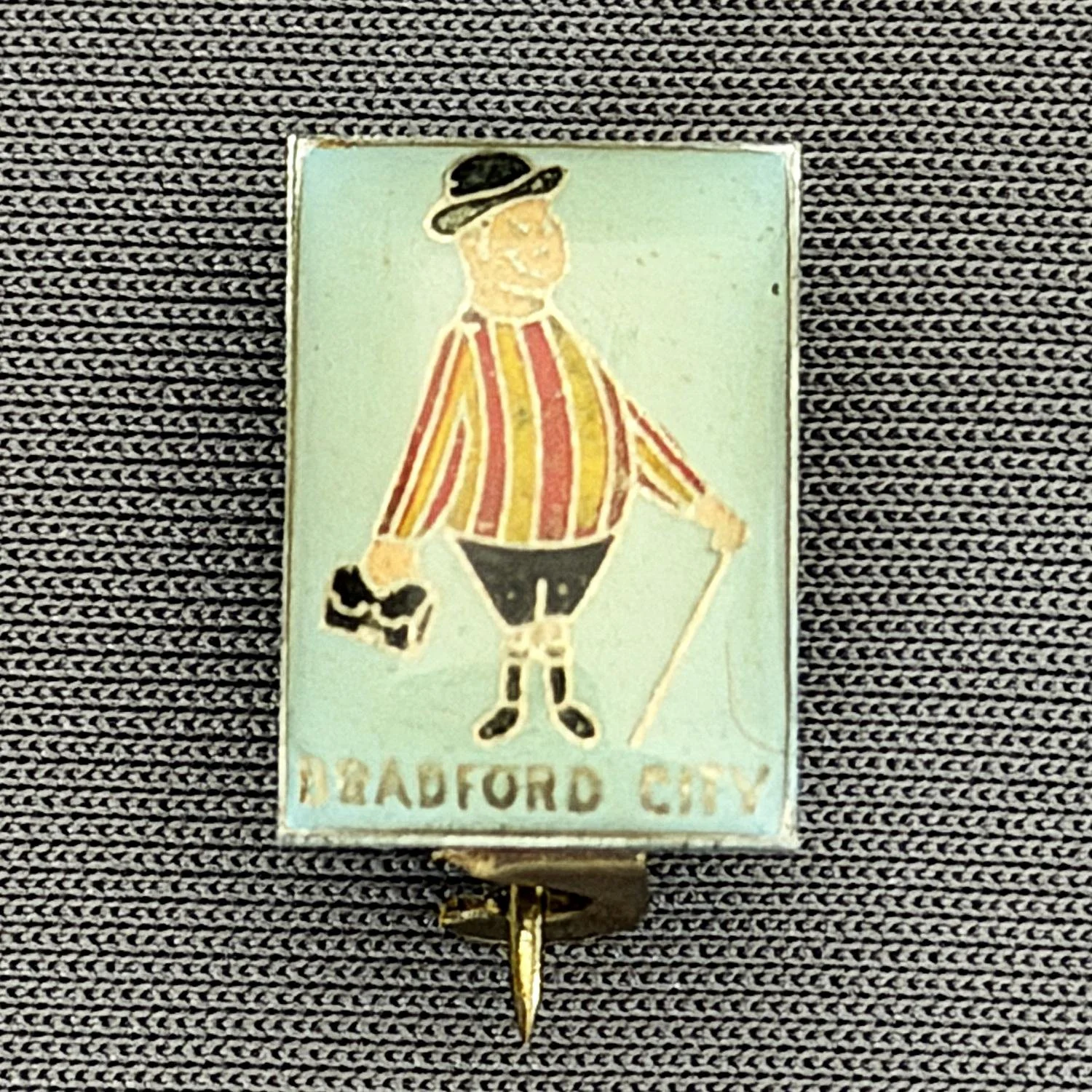 Reference Number: BCGEN008
Size: H 15.5 mm x W 10.8 mm
Pin Type: Brooch Pin
Plating: Silver
Value: £15
Manufacturer: Unknown, possibly Russian
Comments: City Gent, Small Plastic Domed 