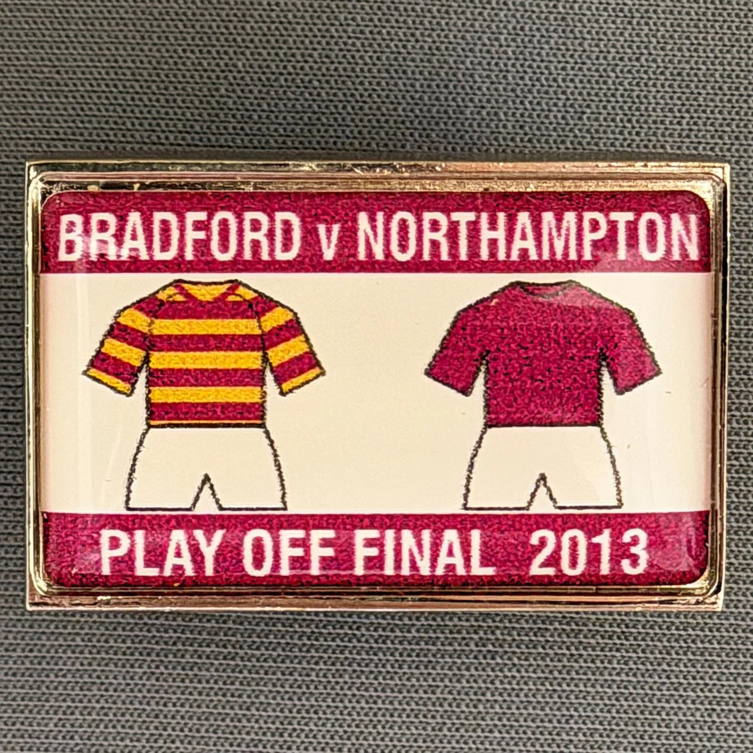 Reference Number: BCOFIX025
Size: H 21.3 mm x W 32.9 mm
Pin Type: Metal Clutch
Plating: Silver
Value: £4
Manufacturer: Unknown
Comments: League 2 Play Off Final City v Northampton Town 2013, Claret Version, Plastic Dome