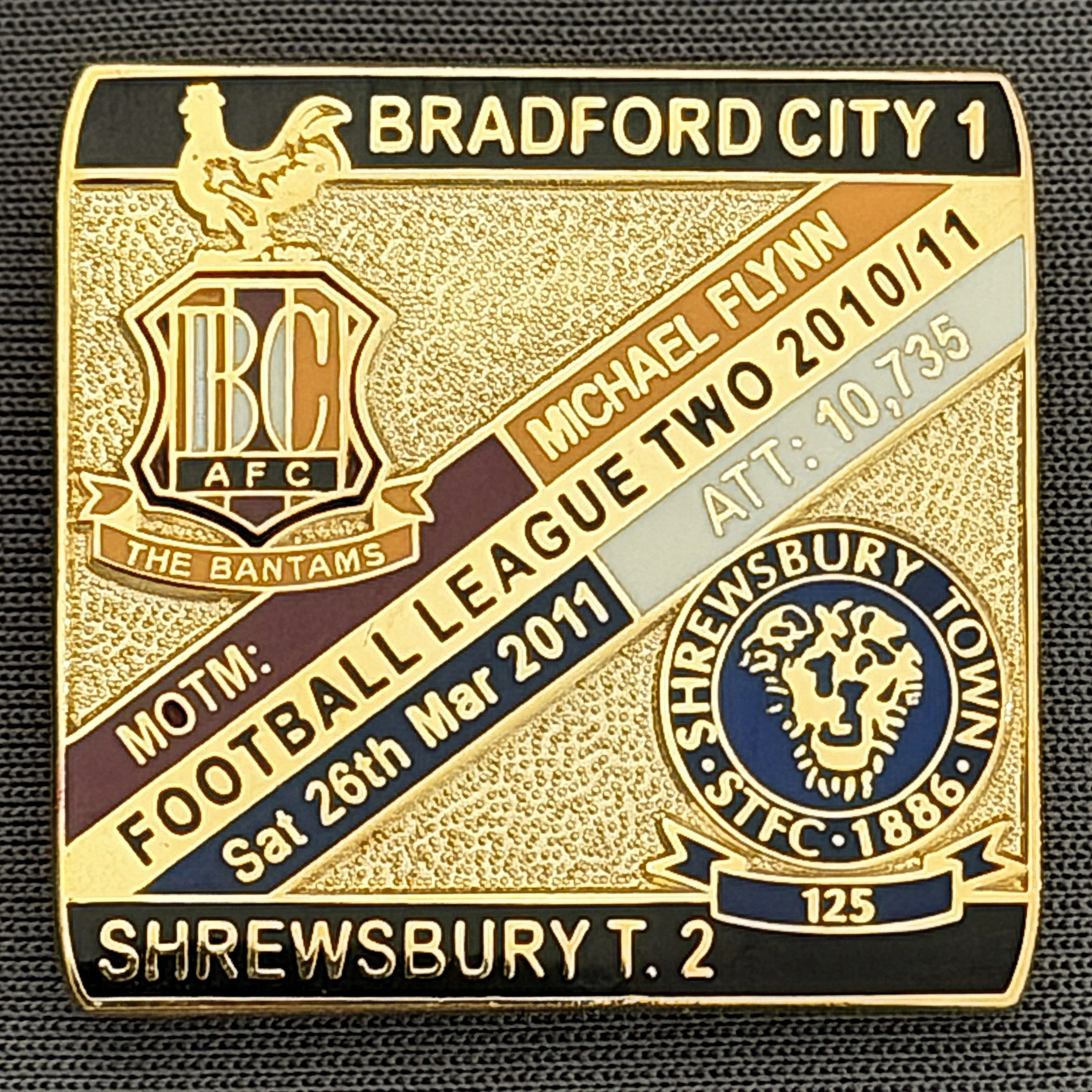 Reference Number: BCFIX065
Size: H 28.3 mm x W 29.3 mm
Pin Type: Brooch Pin
Plating: Gold
Value: £8
Manufacturer: Bradford City Badges
Comments: Bradford City v Shrewsbury town  2010/11 Limited Edition 100 Badges