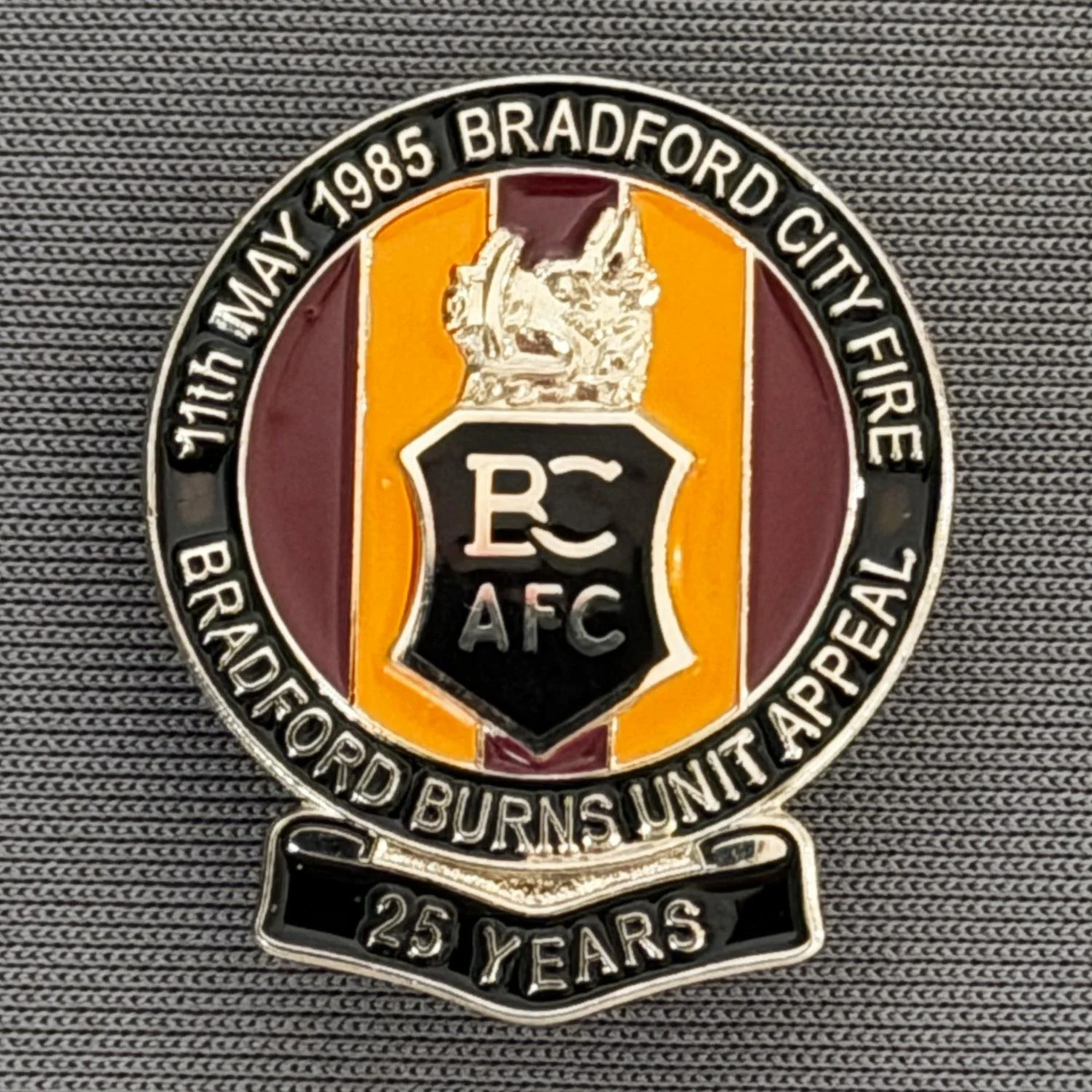 Reference Number: BCFIR002
Size: H 26 mm x W 22 mm
Pin Type: Brooch Pin
Plating: Silver
Value: £10
Manufacturer: Bradford City Badges
Comments: Limited Edition of 250 to raise money for Bradford Burns Unit. Not Numbered.
