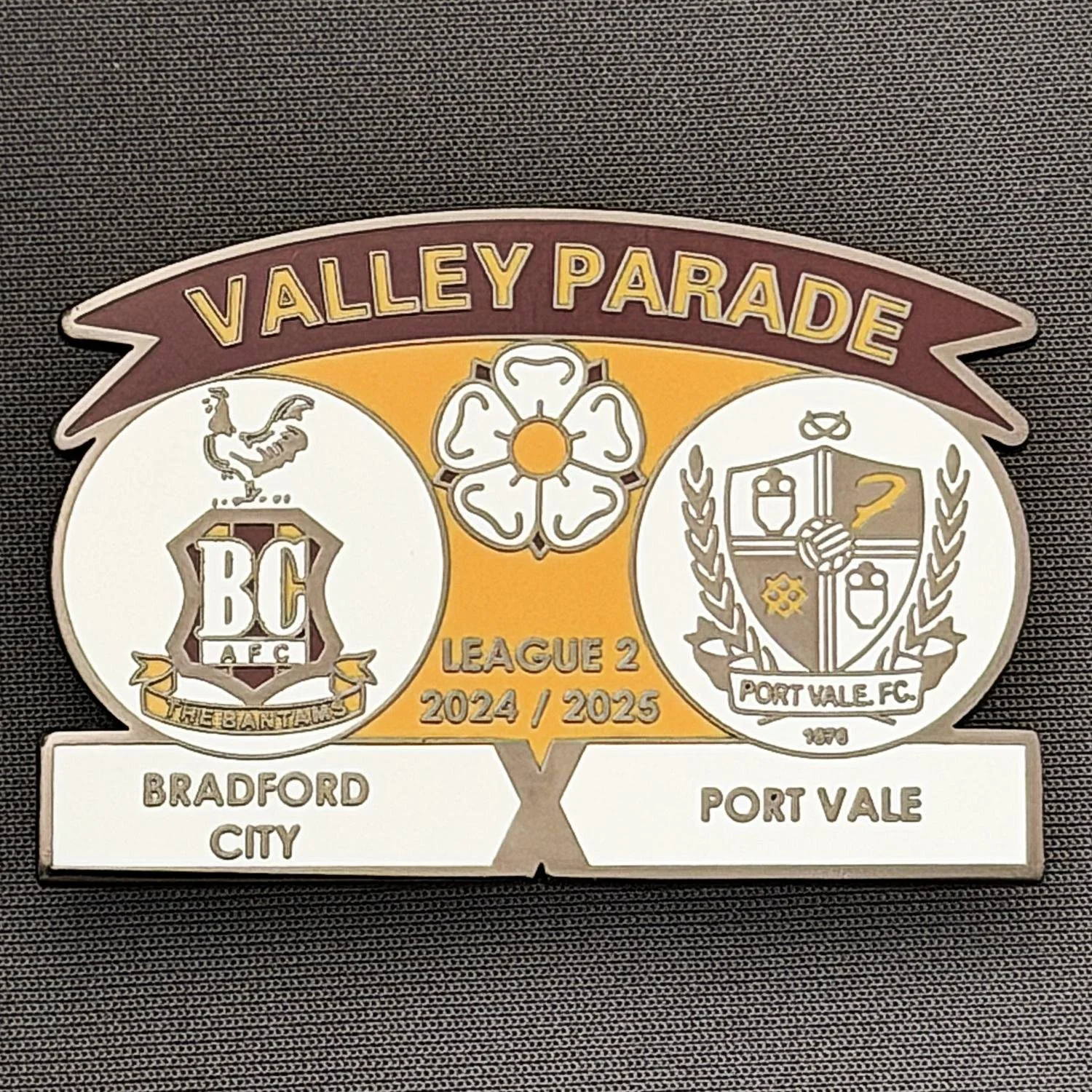 Reference Number: BCFIX425
Size: H 34.3 mm x W 50 mm
Pin Type: Brooch Pin
Plating: Black Nickel
Value: £5
Manufacturer: Unknown
Comments: Bradford City v Port Vale 2024/25.
