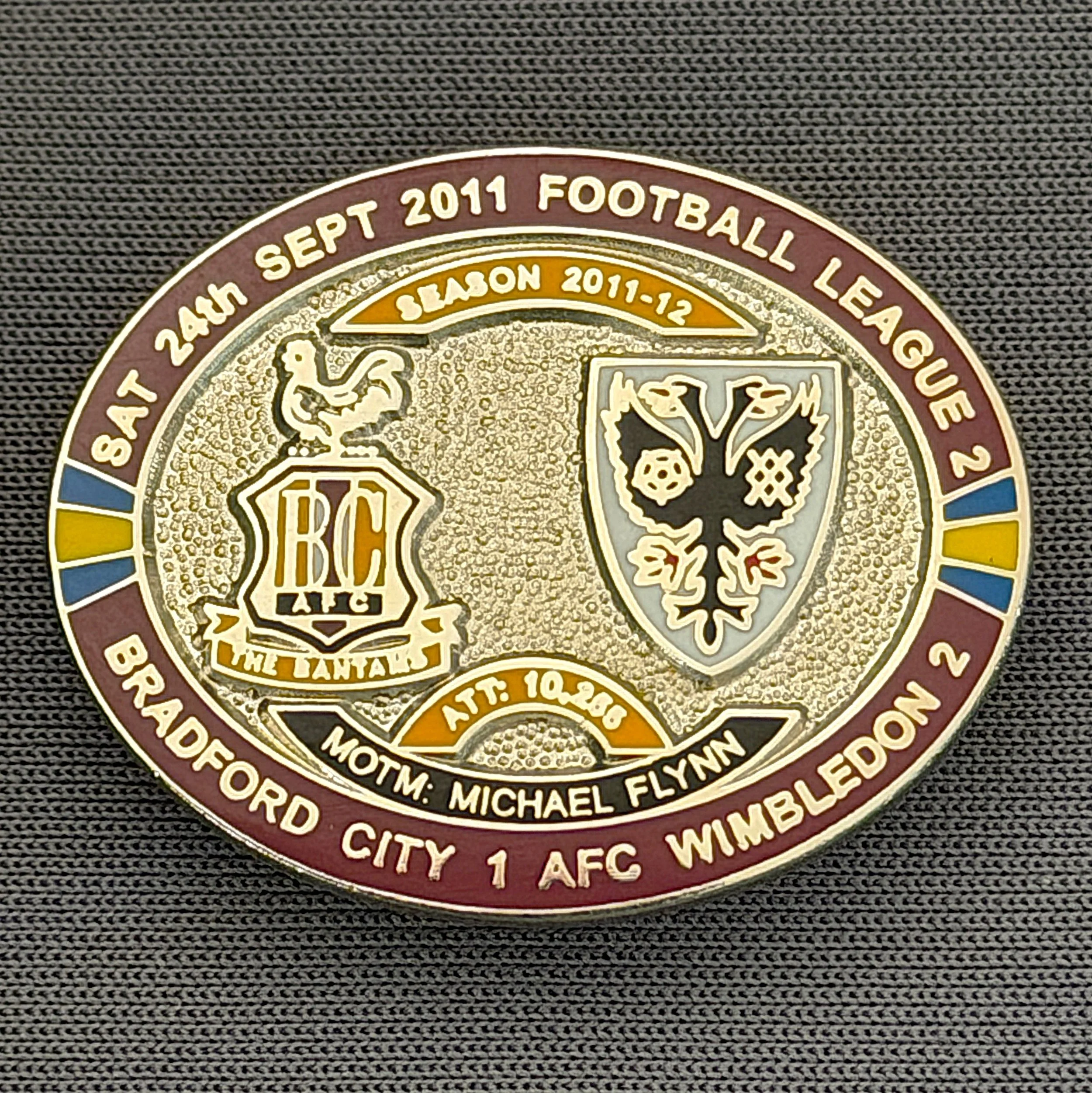 Reference Number: BCFIX097
Size: H 23.6 mm x W 28.7 mm
Pin Type: Brooch Pin
Plating: Silver
Value: £10
Manufacturer: Bradford City Badges
Comments: Bradford City v A.F.C. Wimbledon  2011/12 Limited Edition 20 Badges (Silver Version)