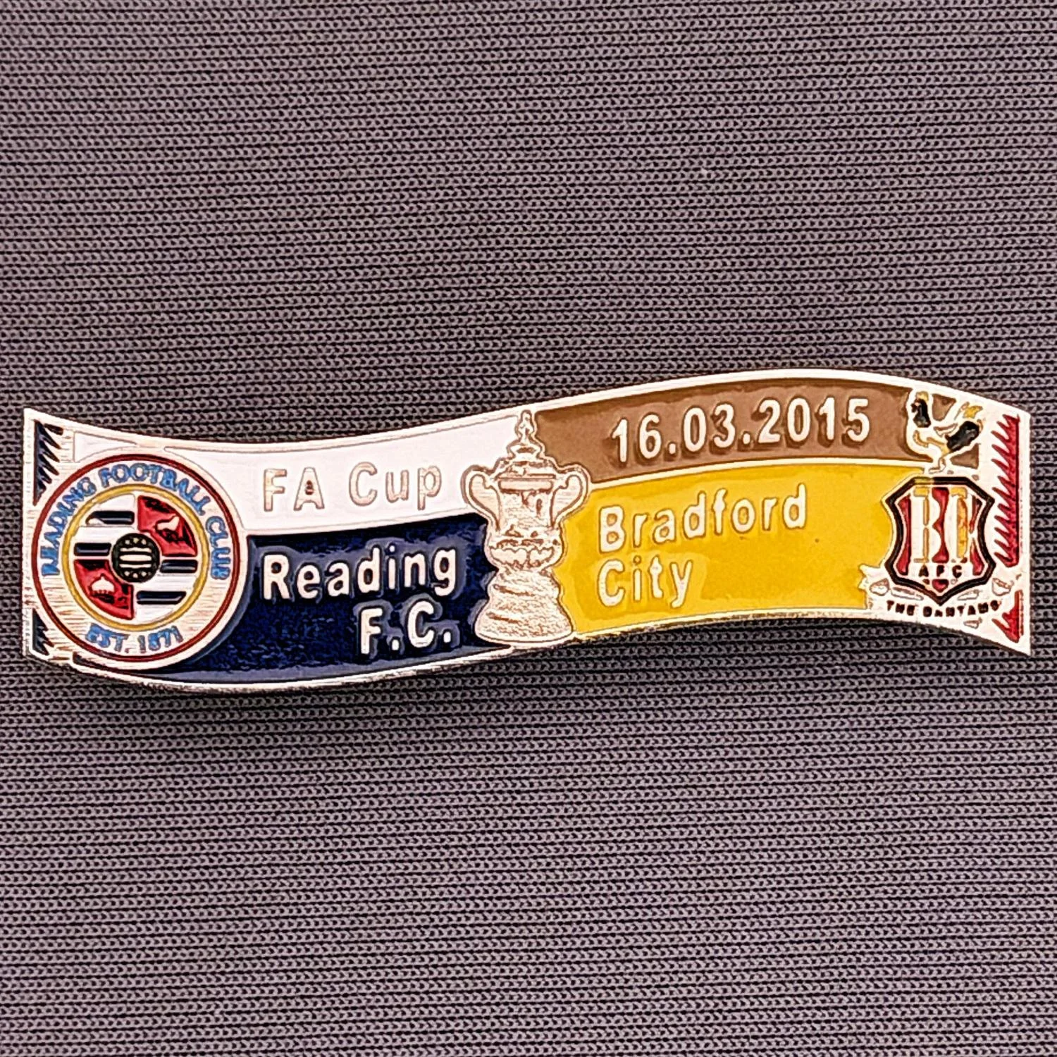 Reference Number: BCFAC137
Size: H 13.3 mm x W 46 mm
Pin Type: Double Metal Clutch
Plating: Silver
Value: £6
Manufacturer: Russian
Comments: F.A. Cup Quarter Final Replay 2014/15, Away v Reading