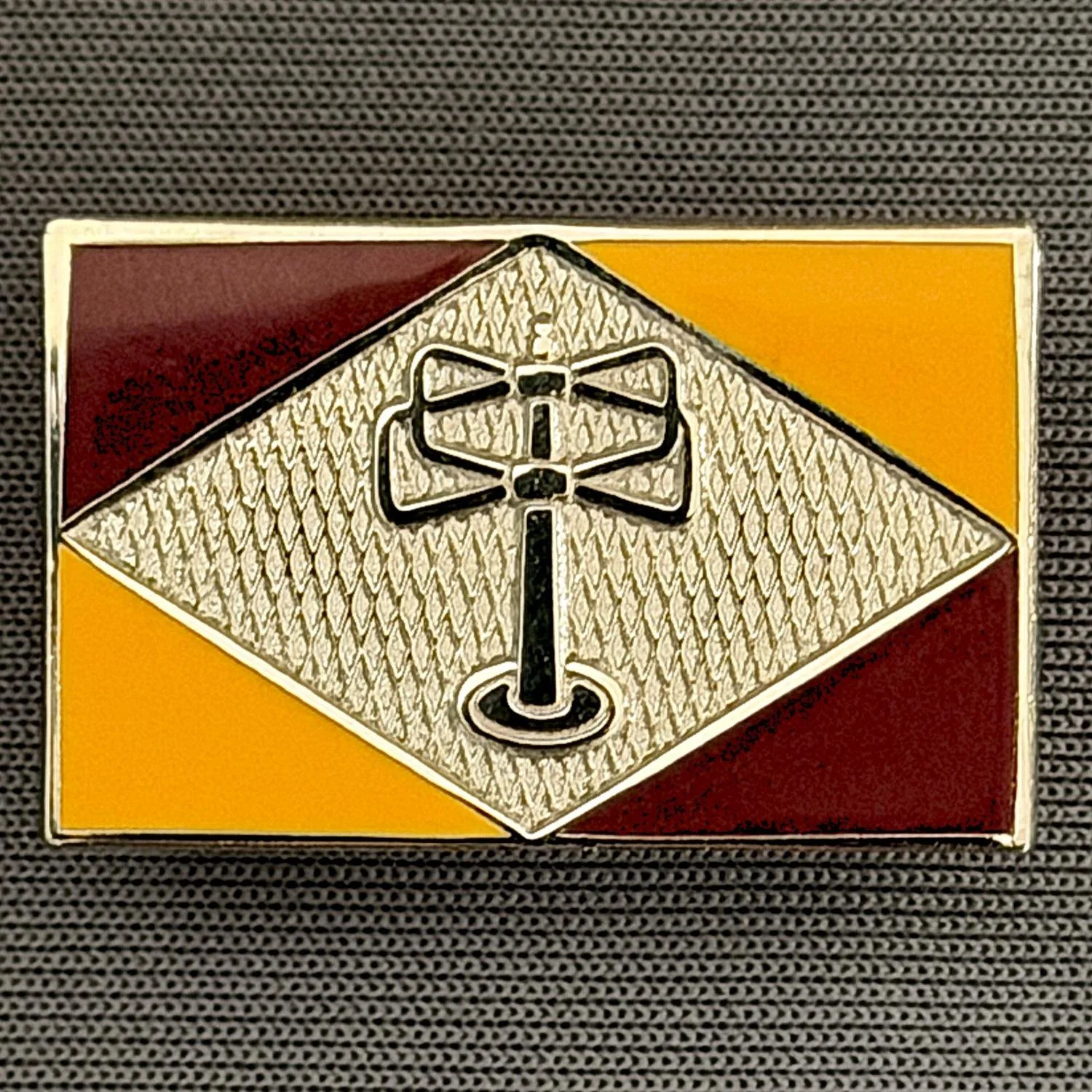 Reference Number: BCUN057
Size: H 20.5 mm x W 32 mm
Pin Type: Brooch Pin
Plating: Nickel
Value: £10
Manufacturer: Bradford City Badges
Comments: Claret & Amber Turnstylewear Badge, Limited Edition of 1