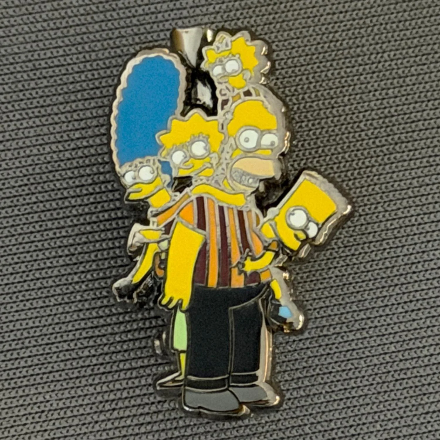 Reference Number: BCCTN060
Size: H 24.7 mm x W 16 mm
Pin Type: Brooch Pin
Plating: Black Nickel
Value: £6
Manufacturer: Not Known
Comments: Simpsons in Bradford City Kit