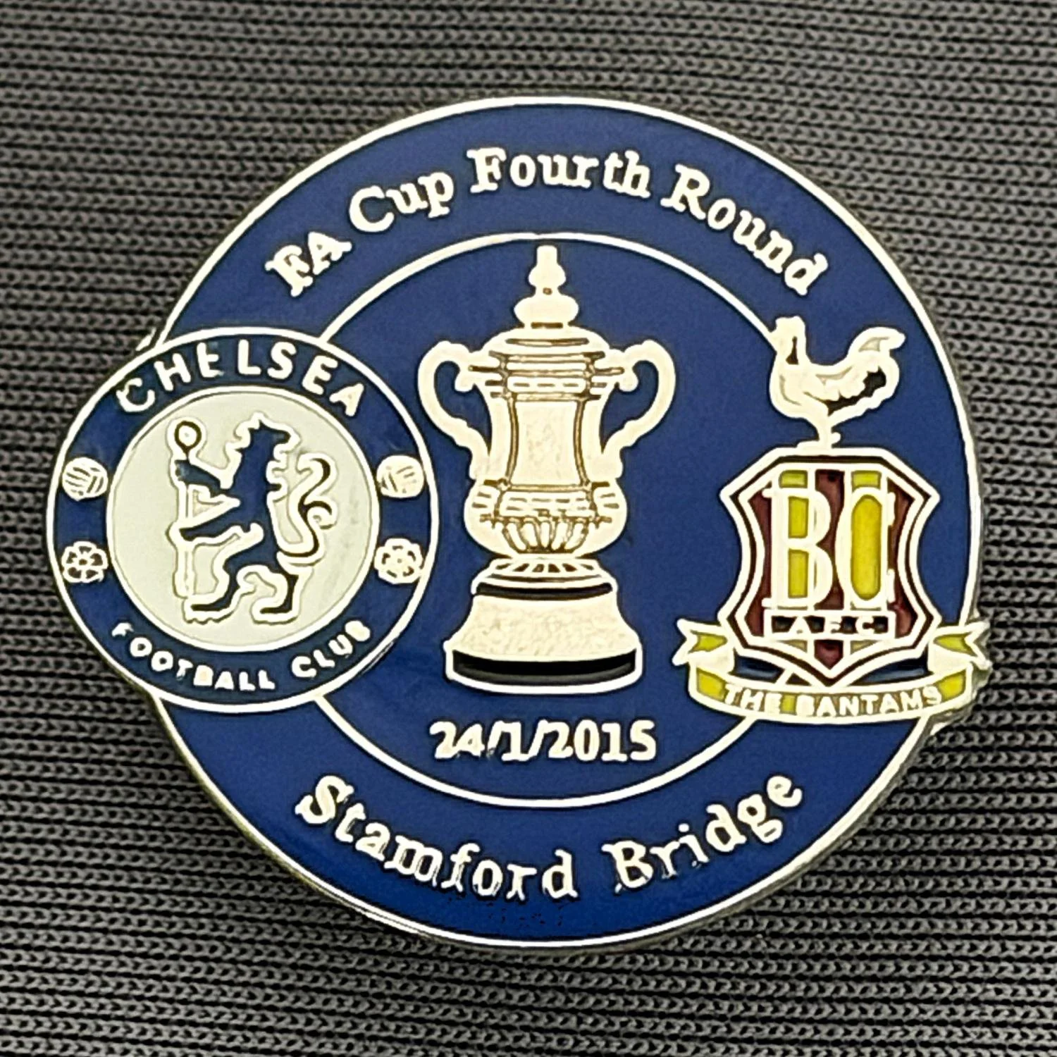 Reference Number: BCFAC091
Size: H 23.3 mm x W 25.3 mm
Pin Type: Metal Clutch
Plating: Silver
Value: £4
Manufacturer: Dan Lloyd
Comments: F.A. Cup Fourth Round 2014/15, Away v Chelsea, Blue Version