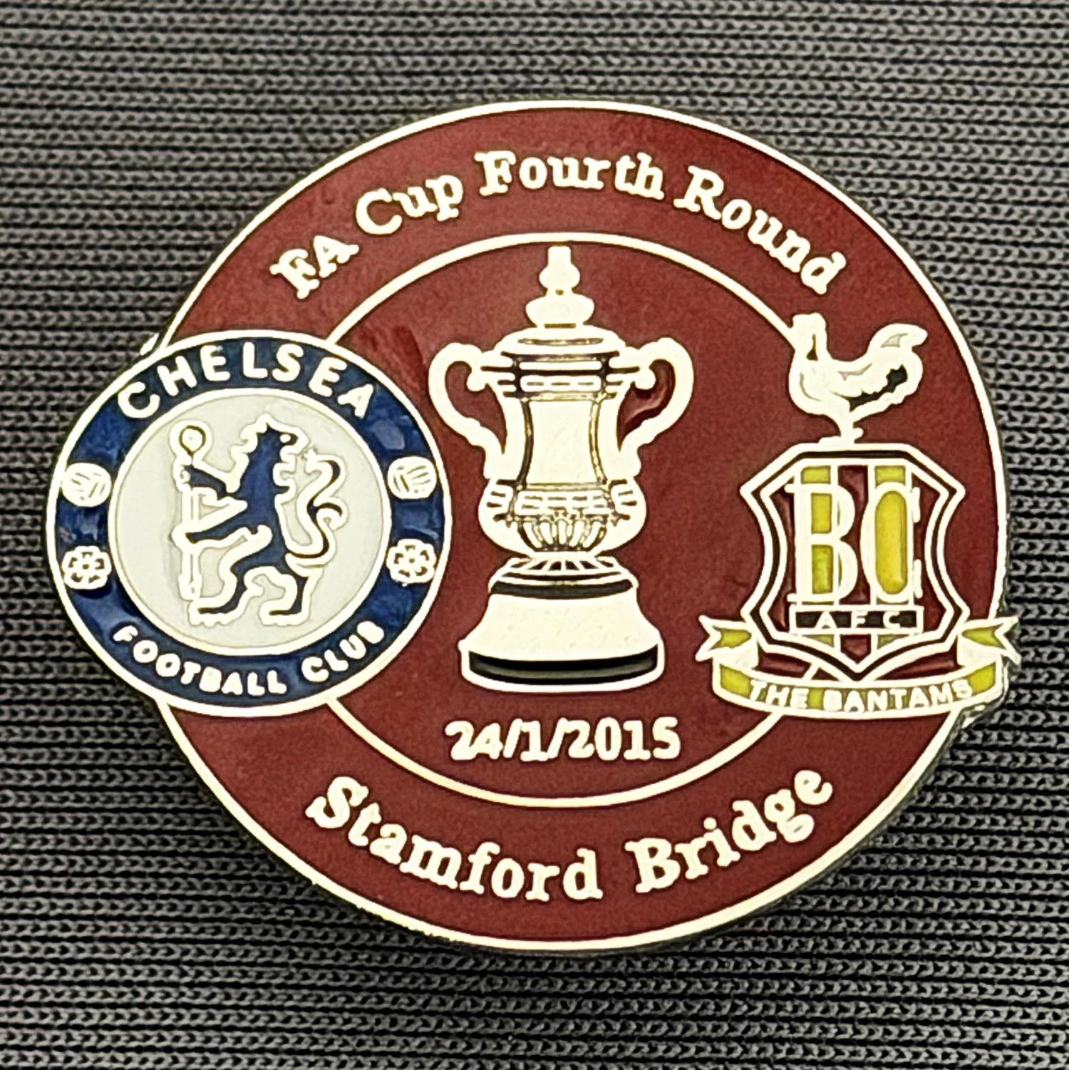Reference Number: BCFAC089
Size: H 23.3 mm x W 25.3 mm
Pin Type: Metal Clutch
Plating: Silver
Value: £4
Manufacturer: Dan Lloyd
Comments: F.A. Cup Fourth Round 2014/15, Away v Chelsea, Claret Version