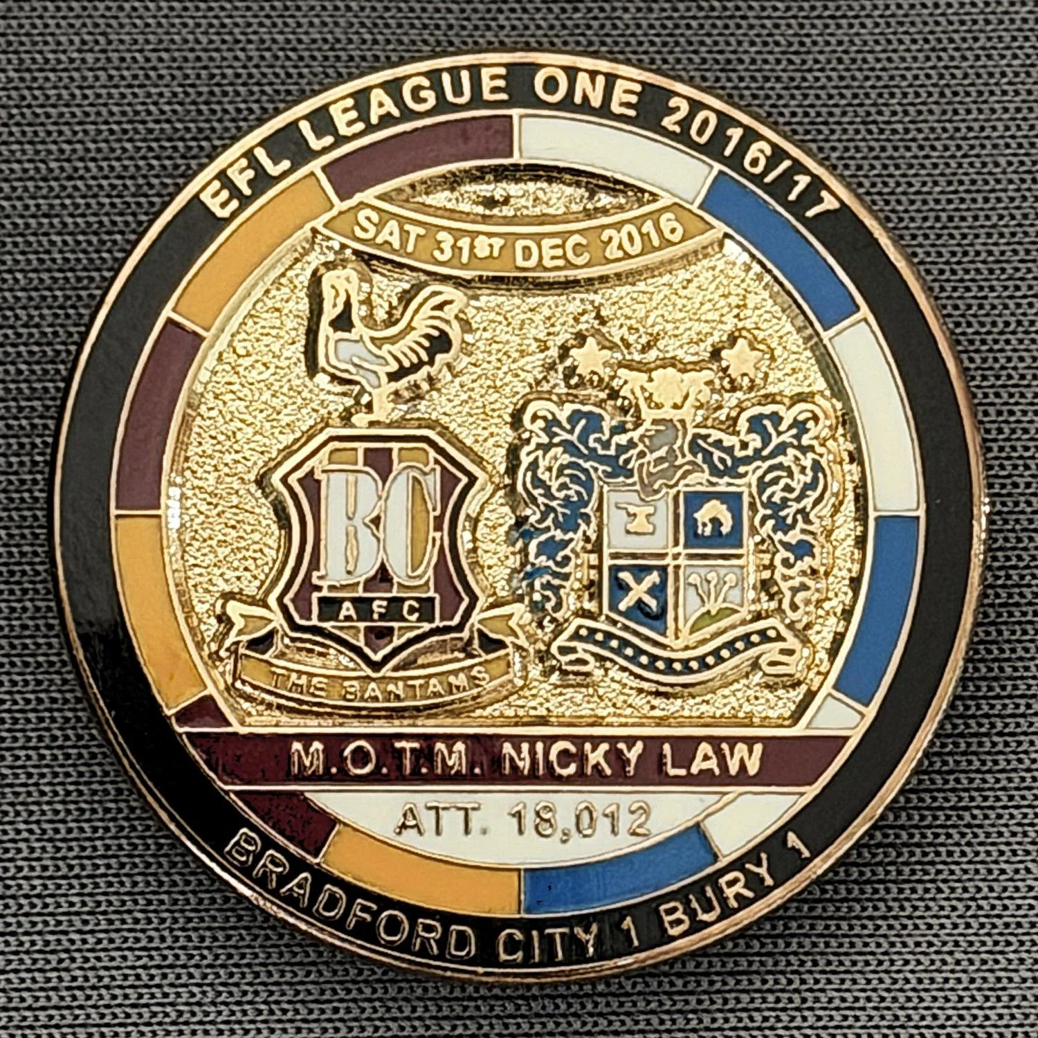 Reference Number: BCFIX381
Size: D 29.4 mm
Pin Type: Brooch Pin
Plating: Gold
Value: £8
Manufacturer: Bradford City Badges
Comments: Bradford City v Bury 2015/16, Limited Edition of 50 Badges (Gold Version)