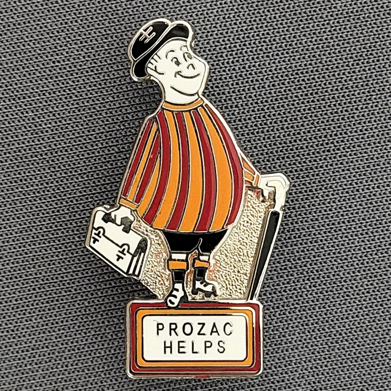 Reference Number: BCGEN037
Size: H 28.2 mm x W 16.8 mm
Pin Type: Brooch Pin
Plating: Silver
Value: £8
Manufacturer: Paraders
Comments: City Gent, Prozac Helps