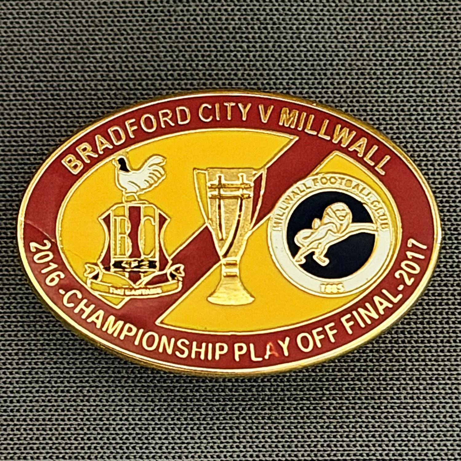Reference Number: BCOFIX040
Size: H 17.9 mm x W 26 mm
Pin Type: Rubber Clutch
Plating: Gold
Value: £6
Manufacturer: Tricky's Pins
Comments: Play Off Final City v Millwall 2017, Claret & Amber Version
