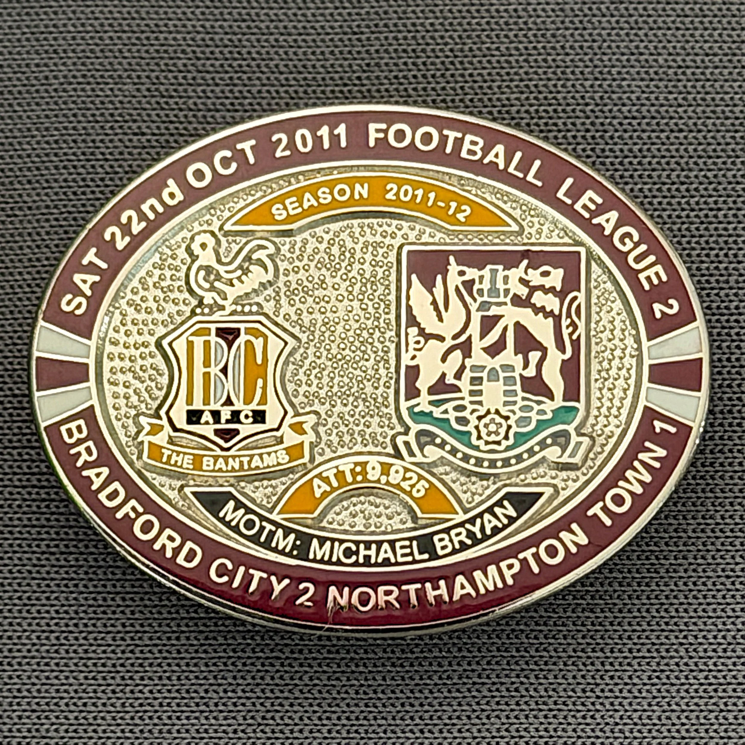 Reference Number: BCFIX099
Size: H 23.6 mm x W 28.7 mm
Pin Type: Brooch Pin
Plating: Silver
Value: £10
Manufacturer: Bradford City Badges
Comments: Bradford City v Northampton Town  2011/12 Limited Edition 20 Badges (Silver Version)