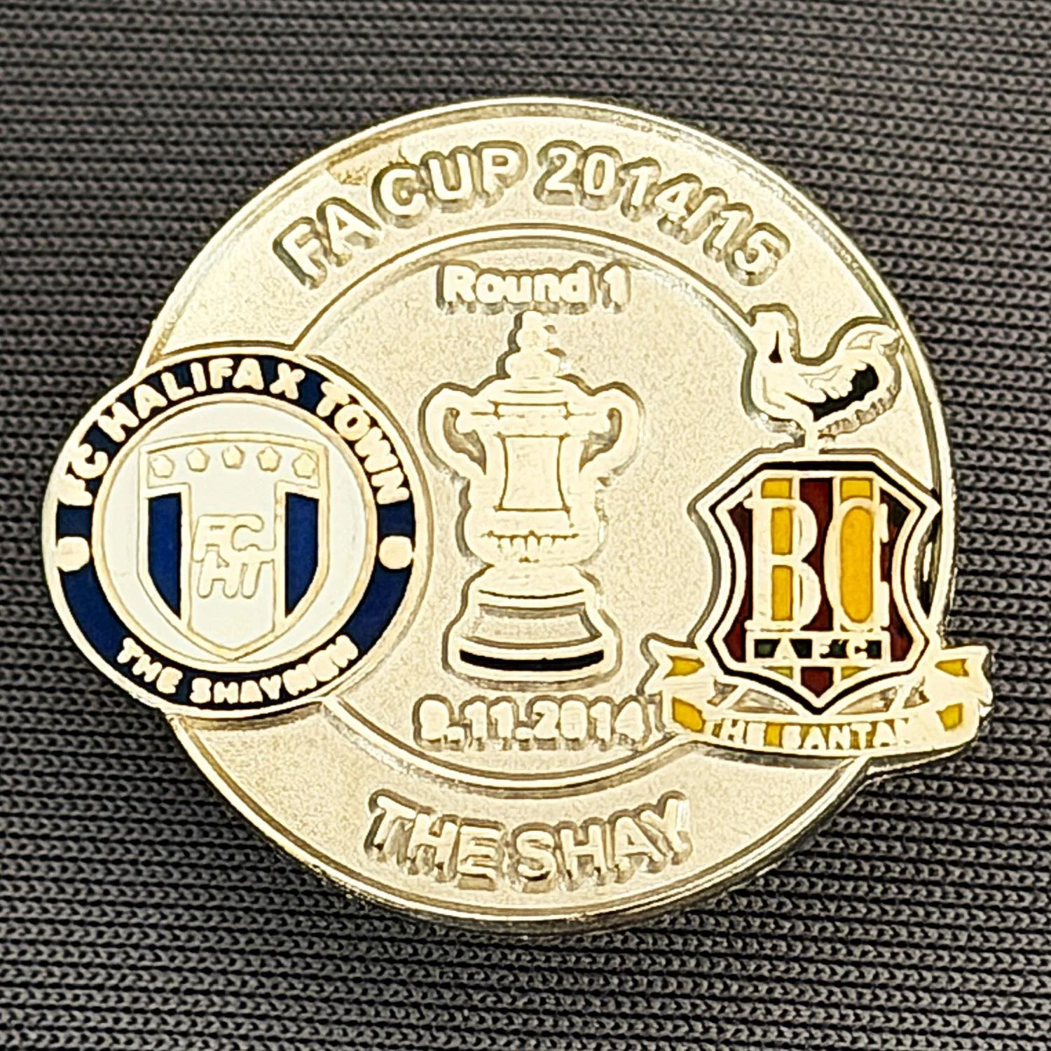 Reference Number: BCFAC061
Size: H 22. 7 mm x W 25.8 mm
Pin Type: Metal Clutch
Plating: Silver
Value: £4
Manufacturer: Dan Lloyd
Comments: F.A. Cup 2014/15 Away v Halifax Town, Silver Version