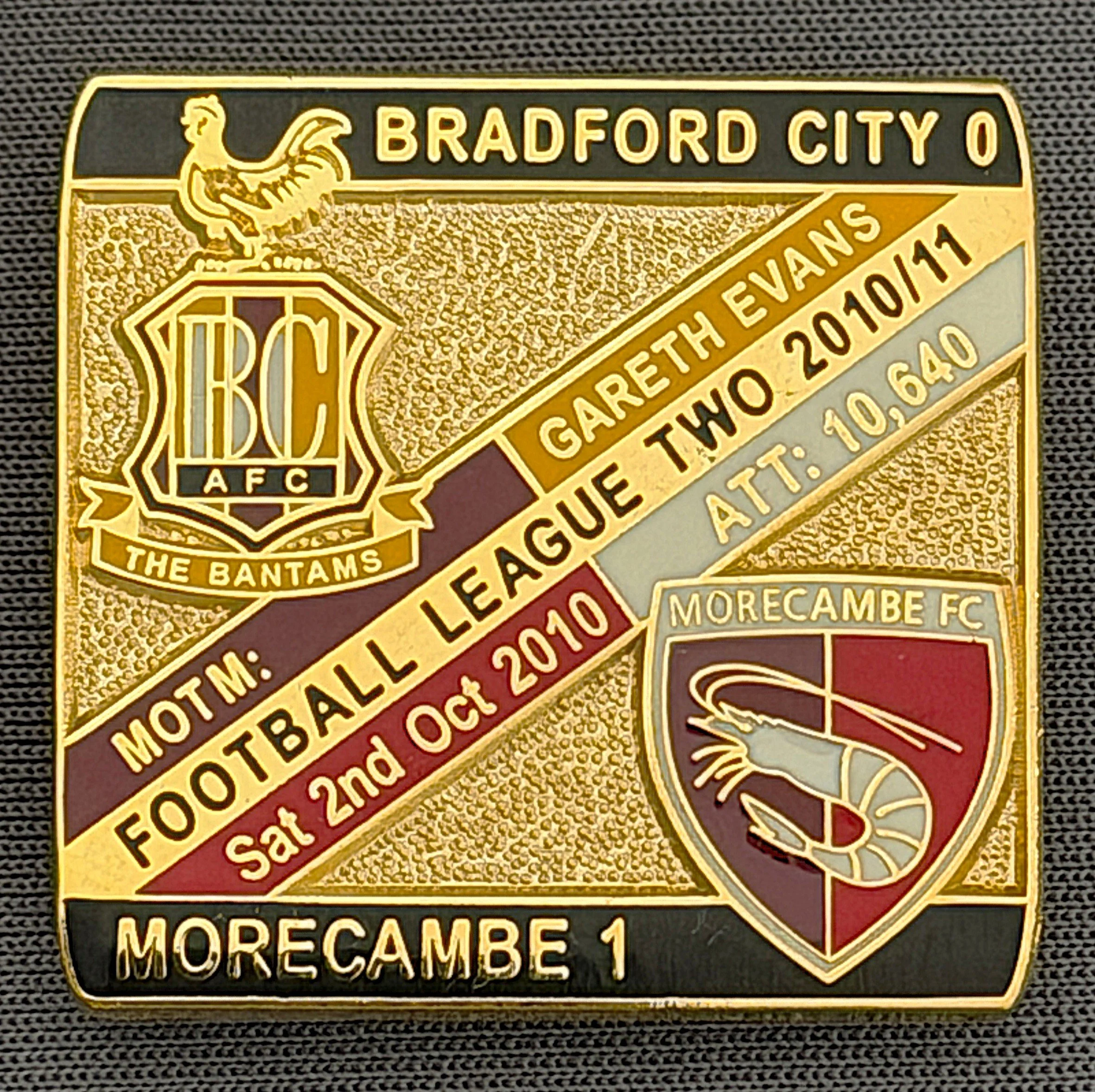 Reference Number: BCFIX051
Size: H 28.3 mm x W 29.3 mm
Pin Type: Brooch Pin
Plating: Gold
Value: £8
Manufacturer: Bradford City Badges
Comments: Bradford City v Morecambe  2010/11 Limited Edition 100 Badges