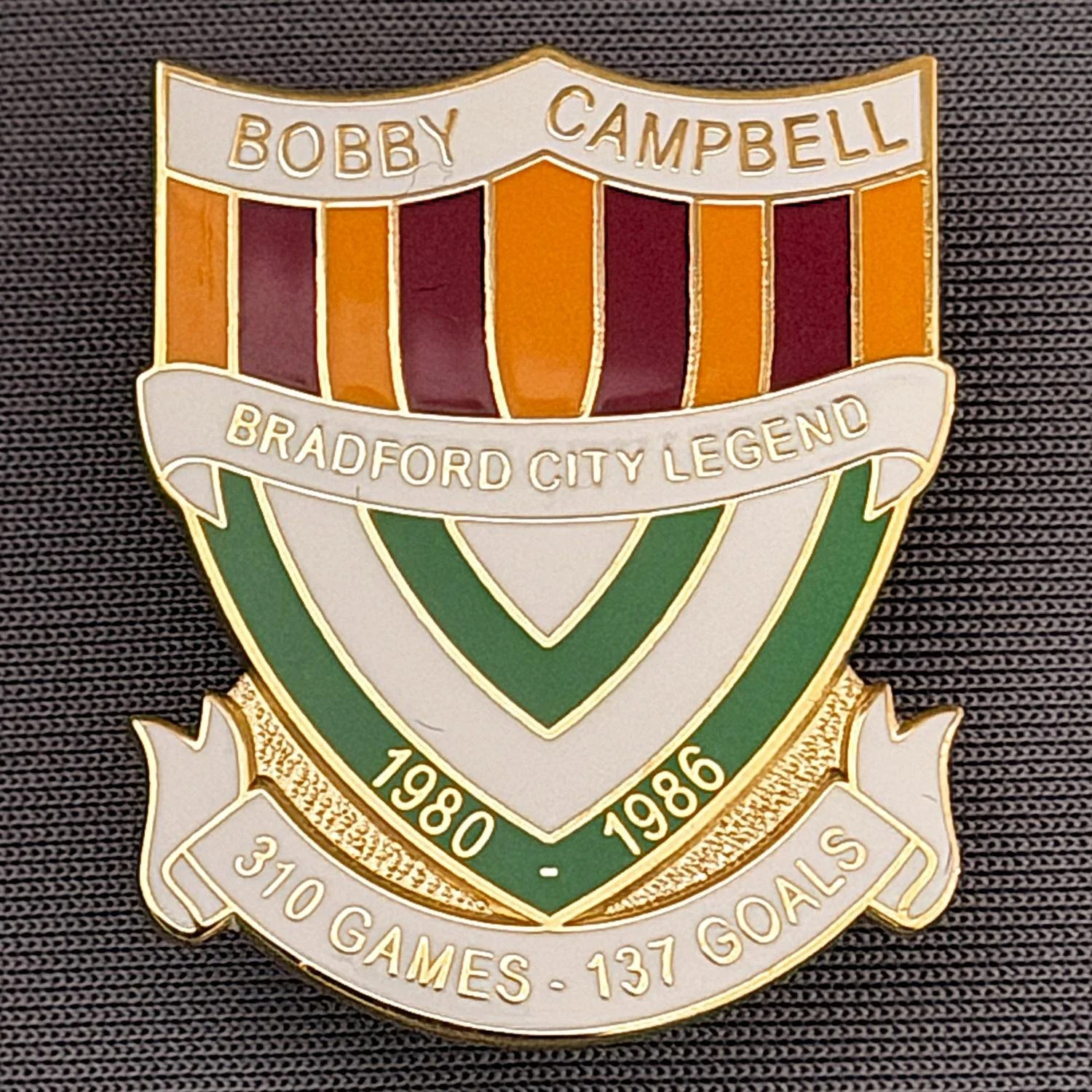 Reference Number: BCUN012
Size: H 32 mm x W 25.9 mm
Pin Type: Metal Clutch
Plating: Gold
Value: £10
Manufacturer: Bradford City Badges
Comments: Bobby Campbell Limited Edition of 25. Boxed Set of 4. Issued 2012. Claret, Amber, Green & White Version.