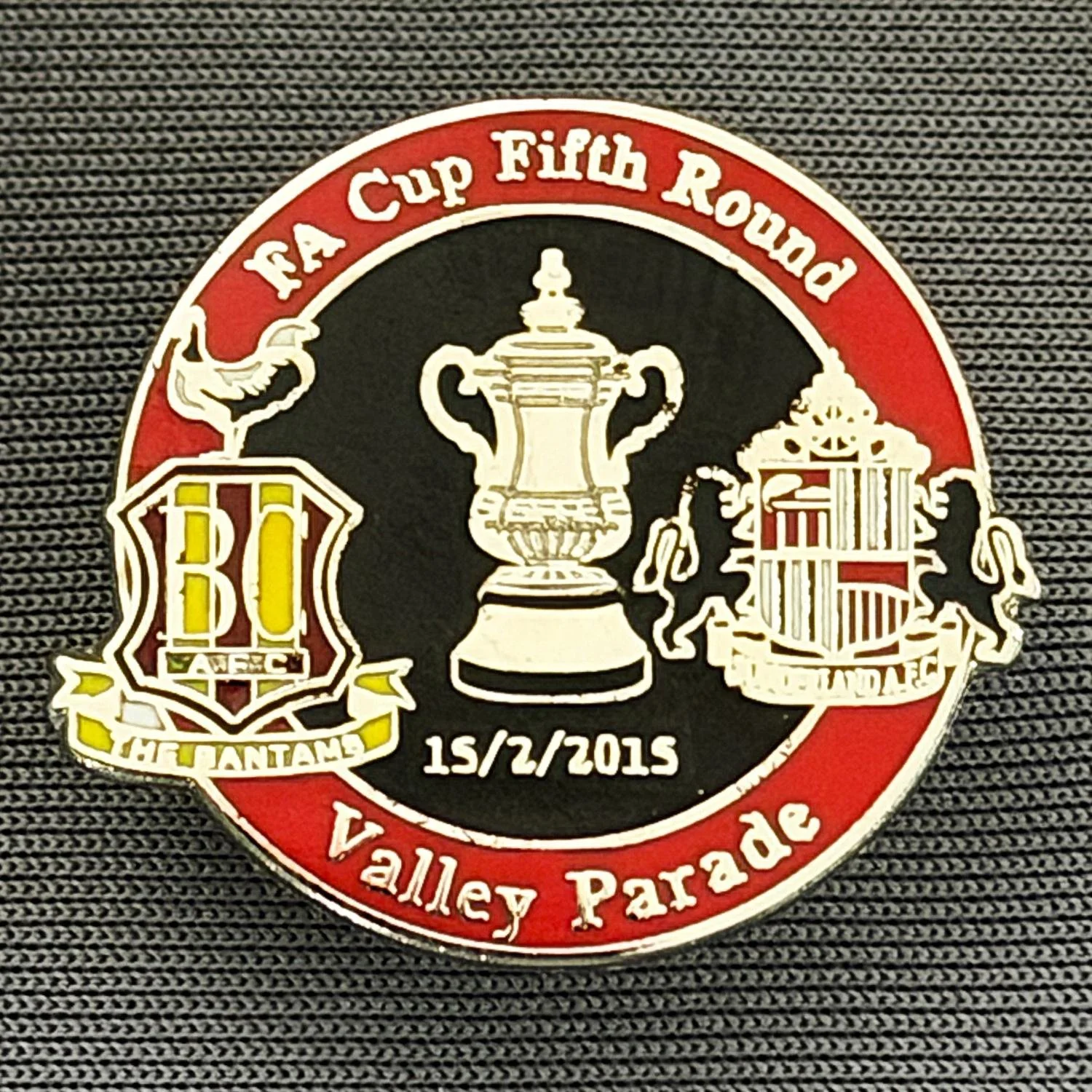 Reference Number: BCFAC105
Size: H 22.8 mm x W 25.4 mm
Pin Type: Metal Clutch
Plating: Silver
Value: £4
Manufacturer: Dan Lloyd
Comments: F.A. Cup Fifth Round 2014/15, v Sunderland, Red & Black Version