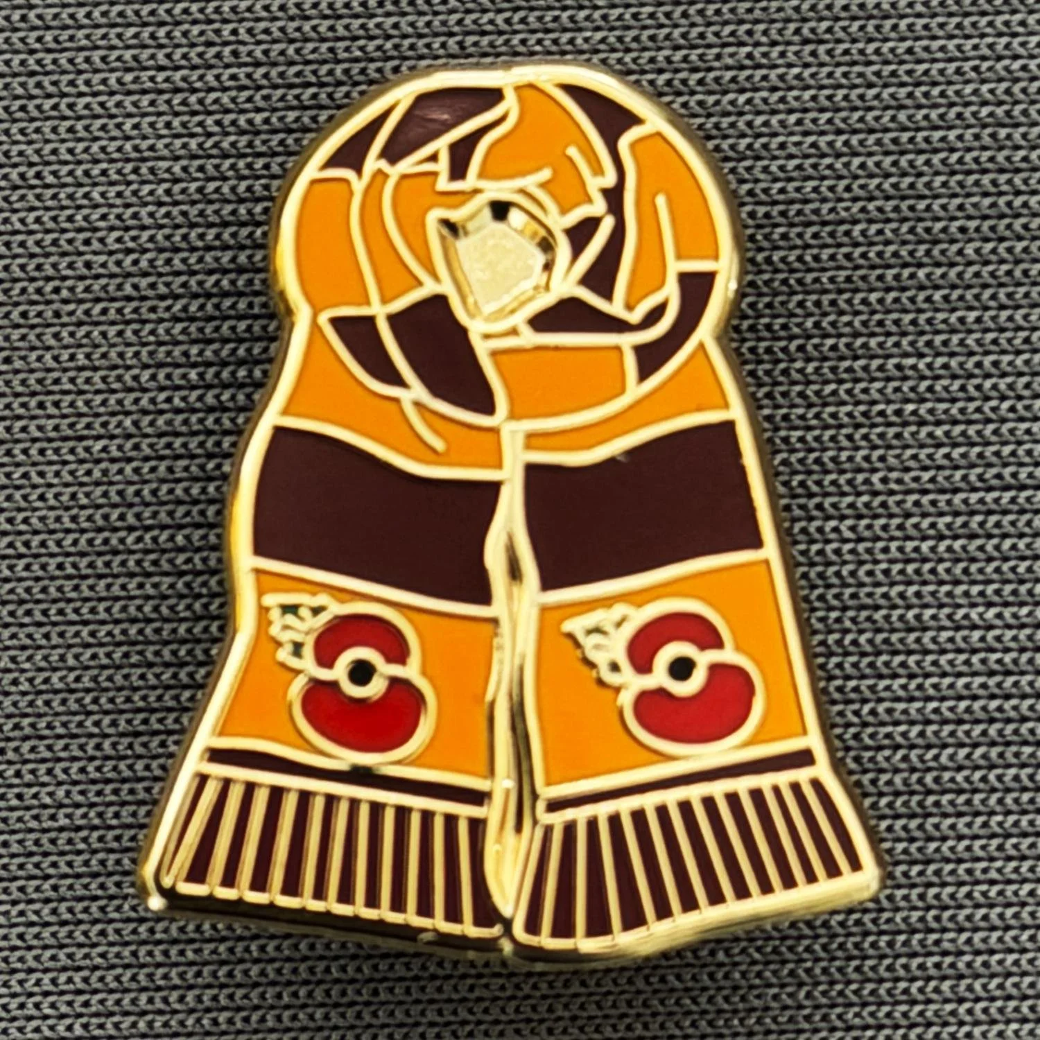 Reference Number: BCSCA004
Size: H 22 mm x W 17.7 mm
Pin Type: Brooch Pin
Plating: Gold
Value: £6
Manufacturer: Unknown
Comments: Claret & Amber Poppy Scarf