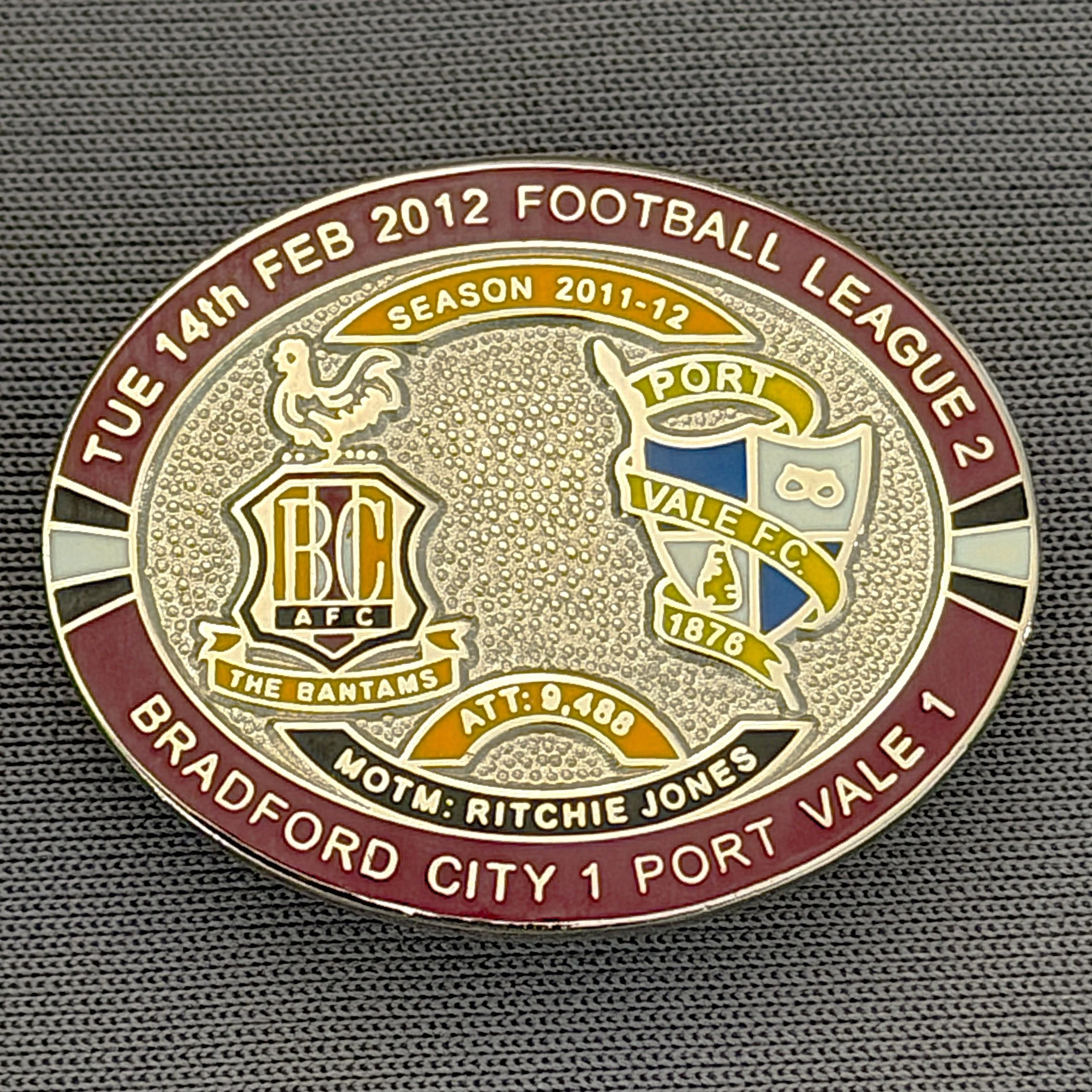 Reference Number: BCFIX107
Size: H 23.6 mm x W 28.7 mm
Pin Type: Brooch Pin
Plating: Silver
Value: £10
Manufacturer: Bradford City Badges
Comments: Bradford City v Port Vale 2011/12 Limited Edition 20 Badges (Silver Version)