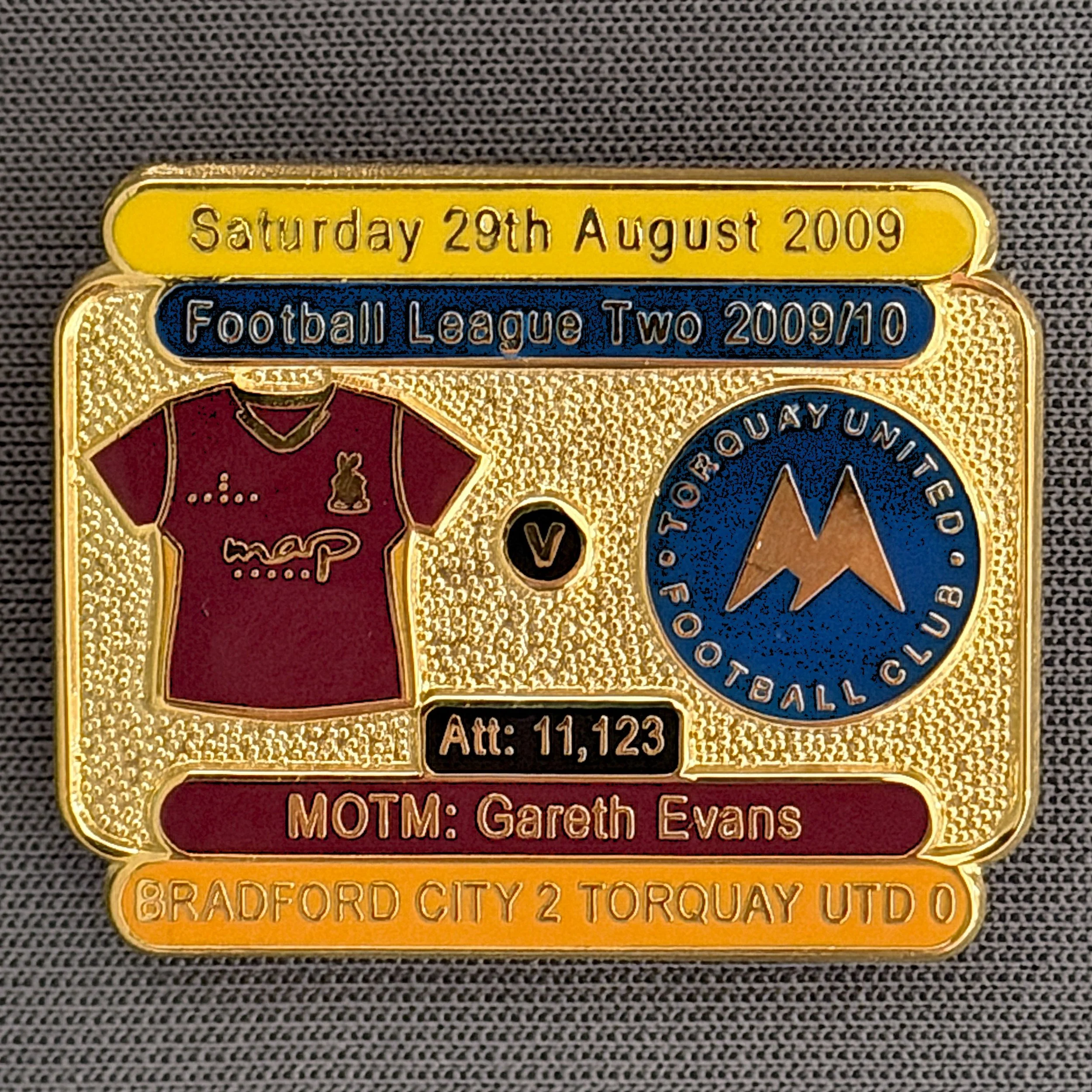 Reference Number: BCFIX026
Size: H 23.1 mm x W 29 mm
Pin Type: Brooch Pin
Plating: Gold
Value: £8
Manufacturer: Bradford City Badges
Comments: Bradford City v Torquay United 2009/10 Limited Edition 100 Badges